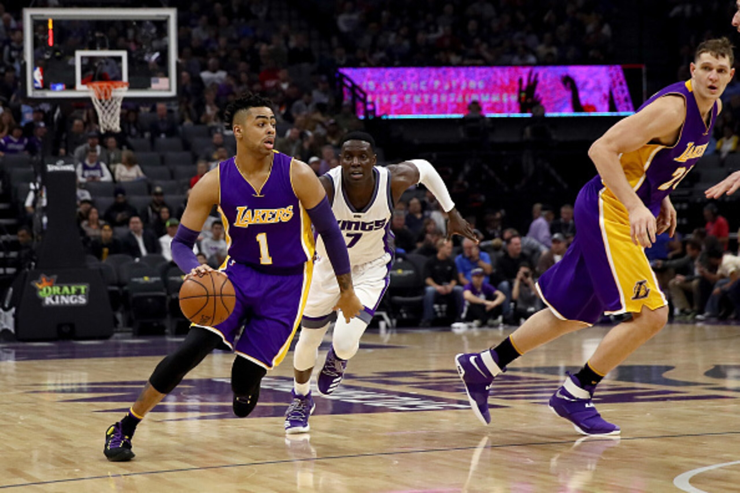 SACRAMENTO, CA - DECEMBER 12:  D'Angelo Russell #1 of the Los Angeles Lakers dribbles past Darren Collison #7 of the Sacramento Kings at Golden 1 Center on December 12, 2016 in Sacramento, California.  NOTE TO USER: User expressly acknowledges and agrees 