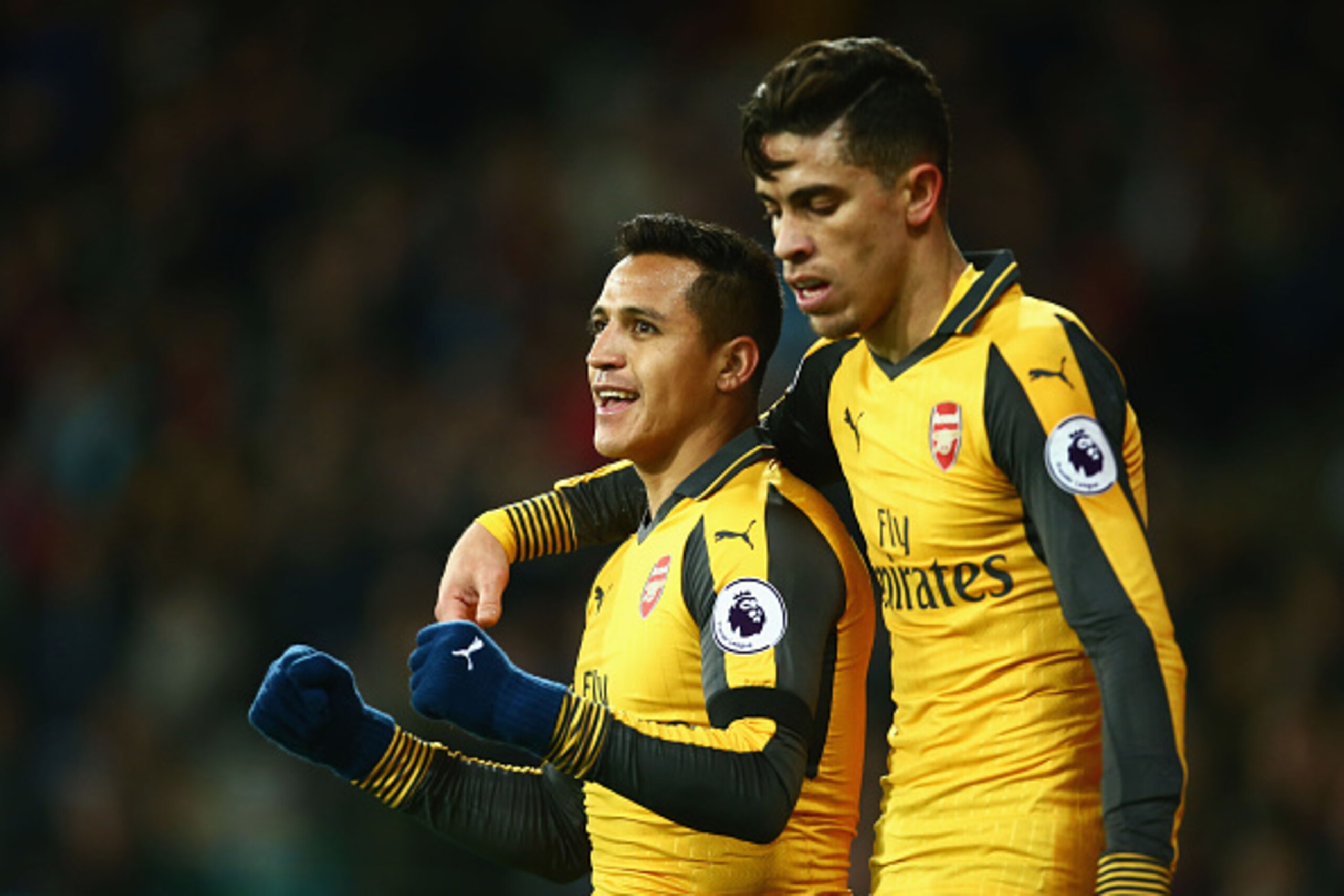 LONDON, ENGLAND - DECEMBER 03:  Alexis Sanchez of Arsenal celebrates with Gabriel Paulista after scoring his team's second goal during the Premier League match between West Ham United and Arsenal at London Stadium on December 3, 2016 in London, England.  