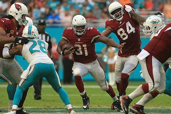 MIAMI GARDENS, FL - DECEMBER 11:  David Johnson #31 of the Arizona Cardinals rushes during a game against the Miami Dolphins at Hard Rock Stadium on December 11, 2016 in Miami Gardens, Florida.  (Photo by Mike Ehrmann/Getty Images)