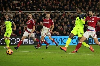 Liverpool's Belgian striker Divock Origi (2R) scores his team's second goal past Middlesbrough's Spanish defender Antonio Barragan during the English Premier League football match between Middlesbrough and Liverpool at Riverside Stadium in Middlesbrough, 