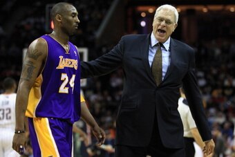 CHARLOTTE, NC - FEBRUARY 14:  Head coach Phil Jackson talks to Kobe Bryant #24 of the Los Angeles Lakers during their game against the Charlotte Bobcats at Time Warner Cable Arena on February 14, 2011 in Charlotte, North Carolina. NOTE TO USER: User expre