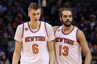 PHOENIX, AZ - DECEMBER 13:  Kristaps Porzingis #6 of the New York Knicks is congratulated by Joakim Noah #13 after scoring against the Phoenix Suns during the first half of the NBA game at Talking Stick Resort Arena on December 13, 2016 in Phoenix, Arizon