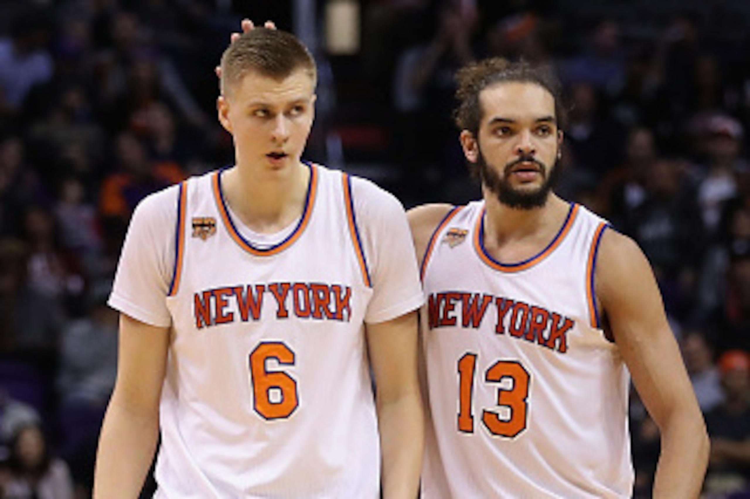 PHOENIX, AZ - DECEMBER 13:  Kristaps Porzingis #6 of the New York Knicks is congratulated by Joakim Noah #13 after scoring against the Phoenix Suns during the first half of the NBA game at Talking Stick Resort Arena on December 13, 2016 in Phoenix, Arizon