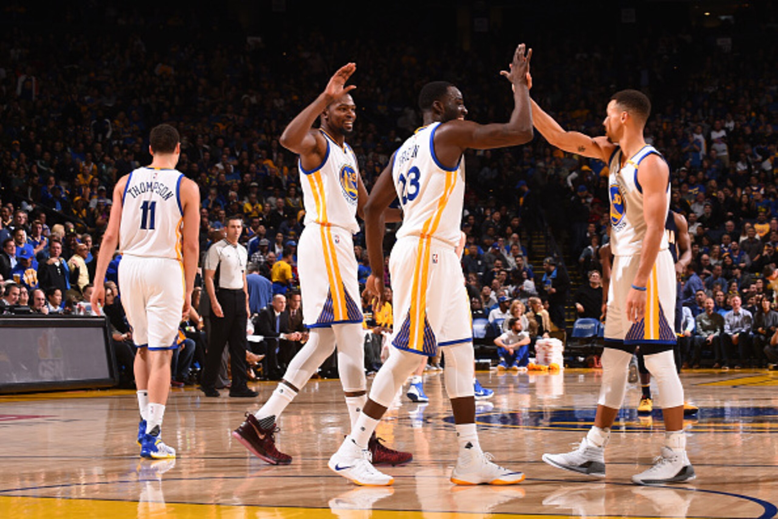 OAKLAND, CA - DECEMBER 5:  Kevin Durant #35 , Draymond Green #23 and Stephen Curry #30 of the Golden State Warriors celebrates during the game against the Indiana Pacers on December 5, 2016 at ORACLE Arena in Oakland, California. NOTE TO USER: User expres