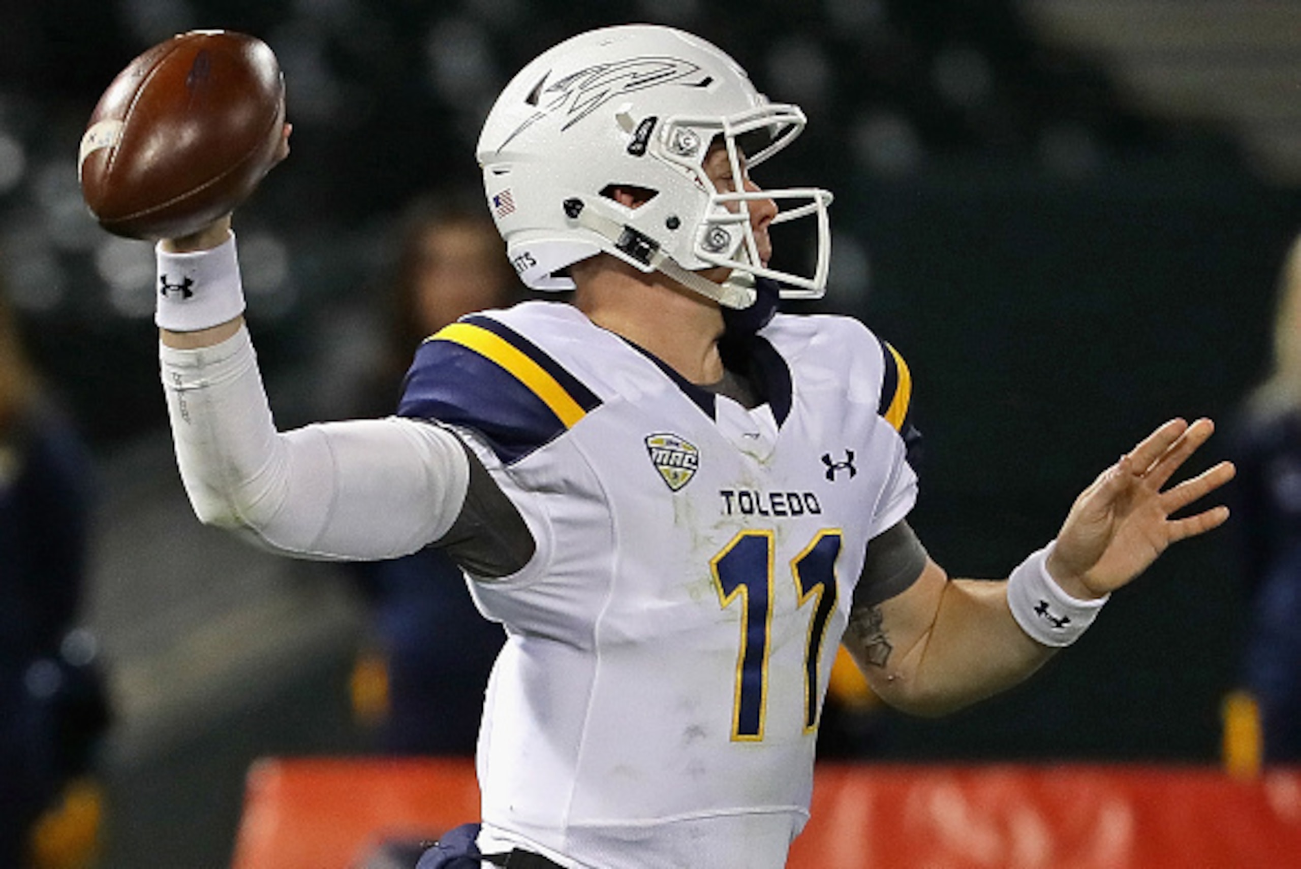 CHICAGO, IL - NOVEMBER 09:  Logan Woodside #11 of the Toledo Rockets passes against the Northern Illinois Huskies at Guaranteed Rate  Field, home of the Chicago White Sox, on November 9, 2016 in Chicago, Illinois.  (Photo by Jonathan Daniel/Getty Images)