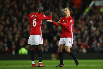 MANCHESTER, ENGLAND - NOVEMBER 27: Zlatan Ibrahimovic of Manchester United (R) celebrates scoring his sides first goal with Paul Pogba of Manchester United (L) during the Premier League match between Manchester United and West Ham United at Old Trafford o