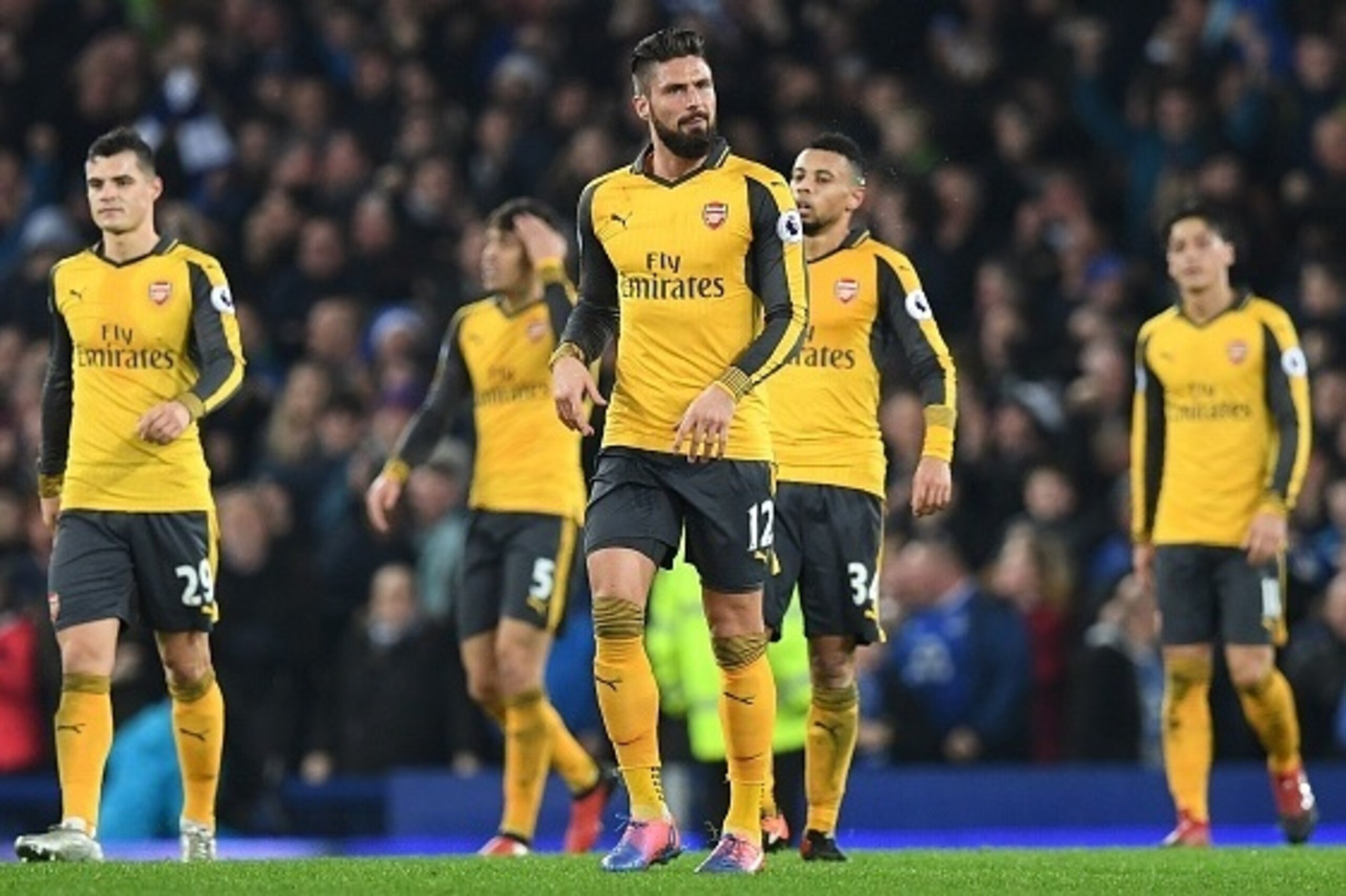 Arsenal's French striker Olivier Giroud (C) and teammates react after Everton's English-born Welsh defender Ashley Williams scored his teams's second goal during the English Premier League football match between Everton and Arsenal at Goodison Park in Liv