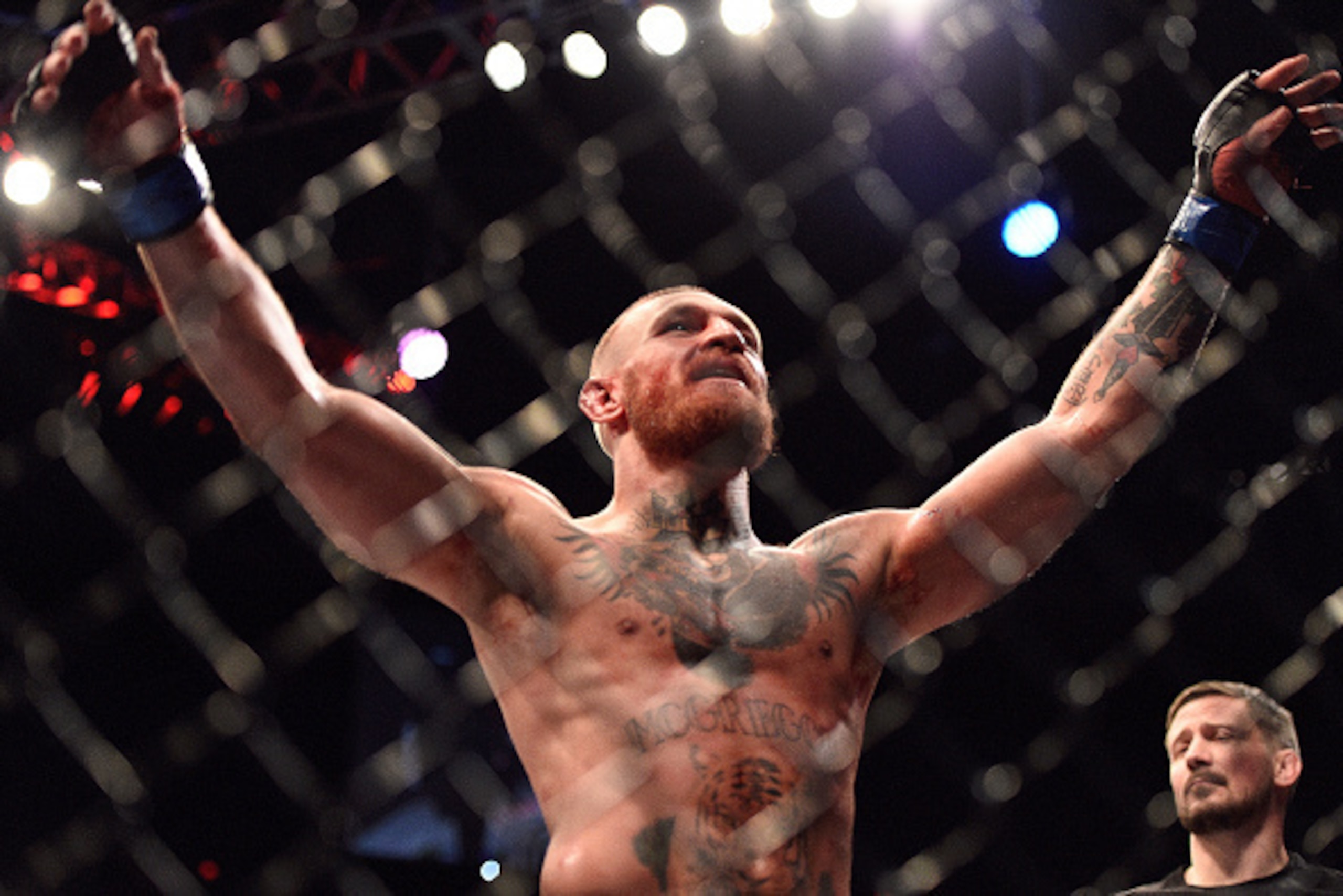 LAS VEGAS, NV - AUGUST 20:  Conor McGregor of Ireland gestures to the crowd after finishing five rounds against Nate Diaz in their welterweight bout during the UFC 202 event at T-Mobile Arena on August 20, 2016 in Las Vegas, Nevada. (Photo by Jeff Bottari