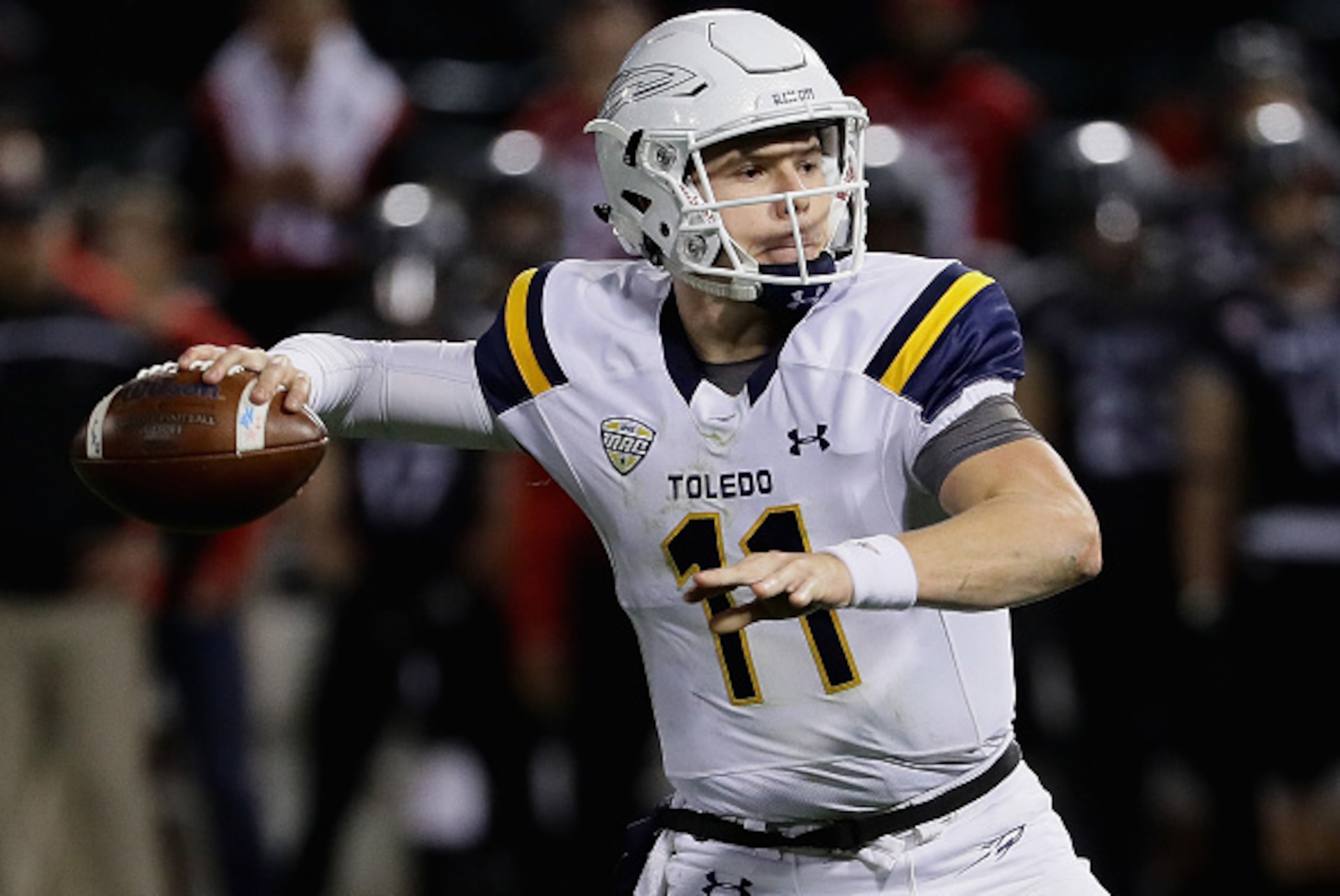 CHICAGO, IL - NOVEMBER 09:  Logan Woodside #11 of the Toledo Rockets throws a touchdown pass against the Northern Illinois Huskies at Guaranteed Rate  Field, home of the Chicago White Sox, on November 9, 2016 in Chicago, Illinois.  (Photo by Jonathan Dani