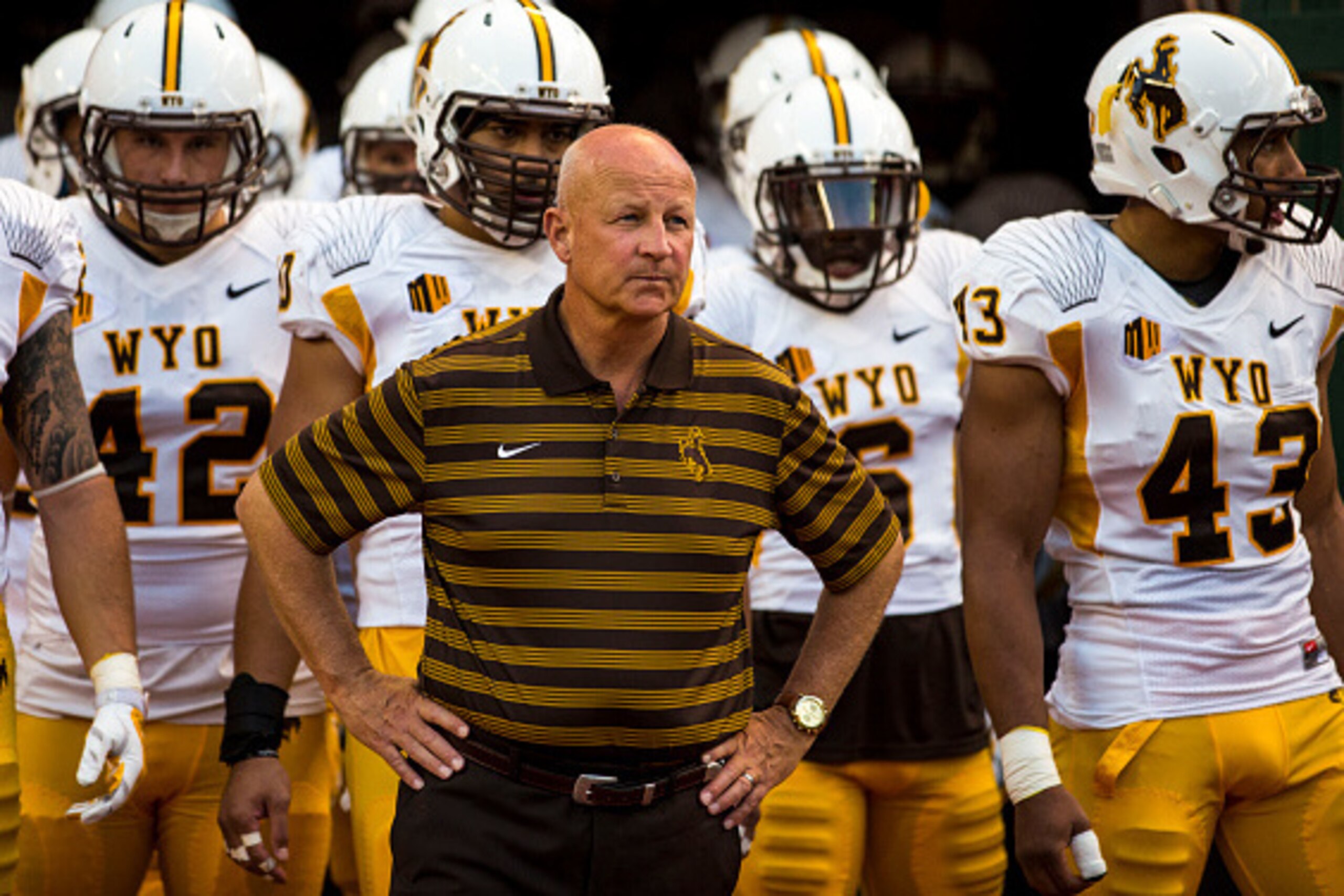 HONOLULU, HI - OCTOBER 11:  Head coach Craig Bohl of the Wyoming Cowboys and the team prepare to take to the field before the first quarter of a college football game between the Wyoming Cowboys and the Hawaii Warriors at Hawaiian Airlines Field at Aloha 