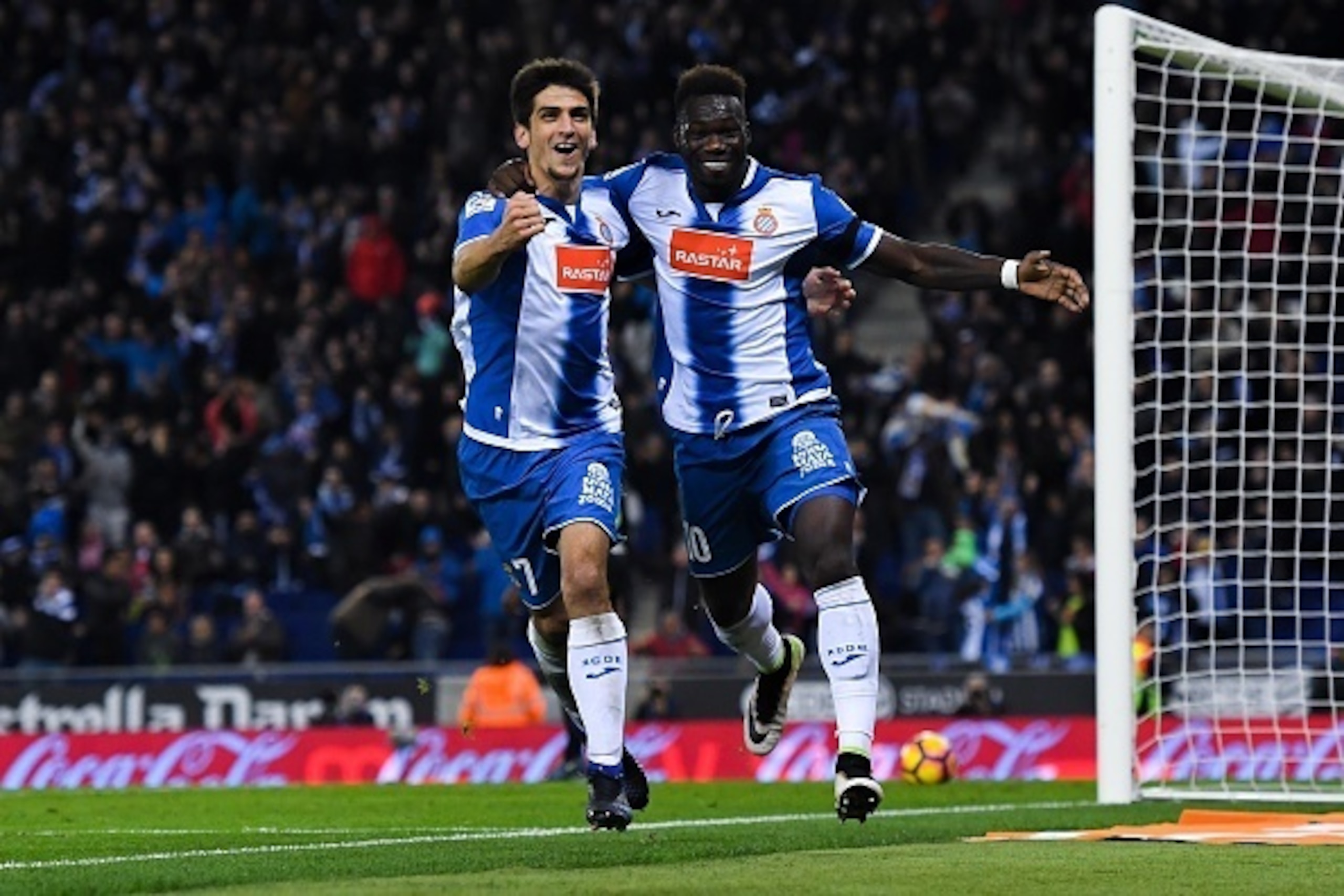 BARCELONA, SPAIN - DECEMBER 11:  Felipe Caicedo (R) of RCD Espanyol celebrates with his team mate Gerard Moreno after scoring his team's first goal during the La Liga match between RCD Espanyol and Real Sporting de Gijon at Cornella-El Prat stadium on Dec