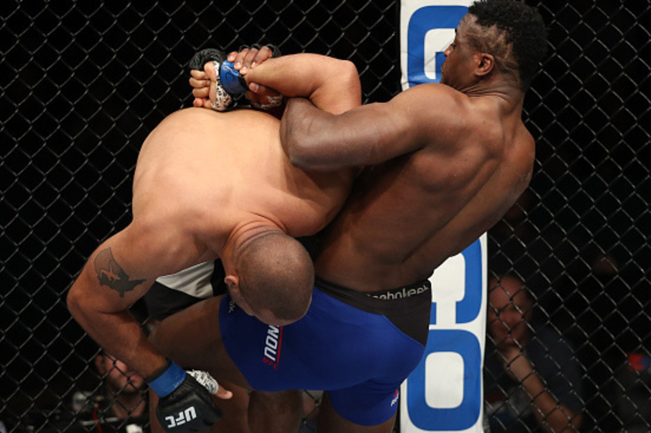 ALBANY, NY - DECEMBER 09:  (R-L) Francis Ngannou of Cameroon secures a kimura submission against Anthony Hamilton in their heavyweight bout during the UFC Fight Night event at the Times Union Center on December 9, 2016 in Albany, New York. (Photo by Patri