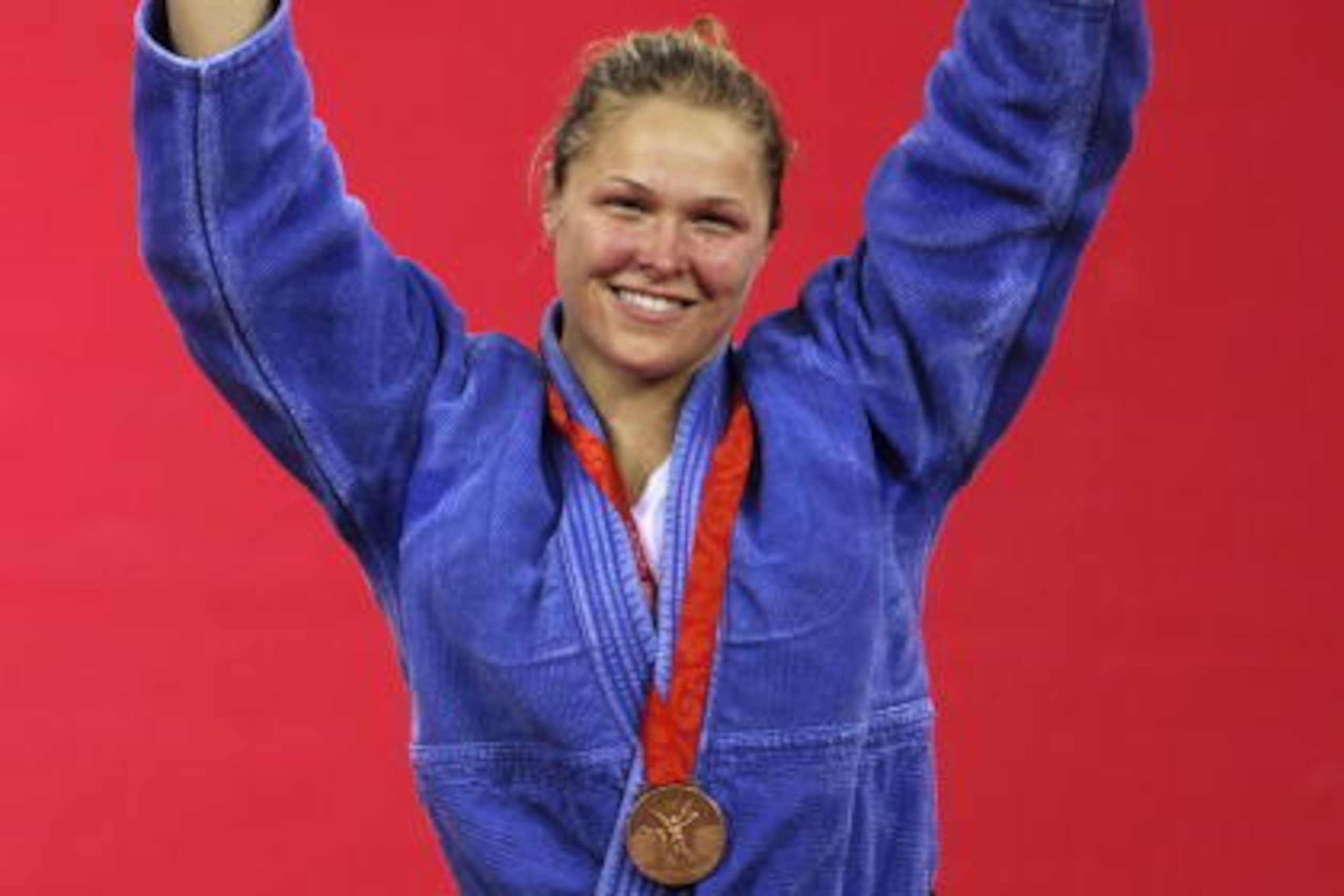 US Ronda Rousey poses with her bronze medal on the podium for the women's -70kg judo competition of the 2008 Beijing Olympic Games on August 13, 2008 in Beijing. Japan's Masae Ueno won the gold, Cuba's Anaysi Hernandez won the silver, US Ronda Rousey and US Ronda Rousey poses with her bronze medal on the podium for the women's -70kg judo competition of the 2008 Beijing Olympic Games on August 13, 2008 in Beijing. Japan's Masae Ueno won the gold, Cuba's Anaysi Hernandez won the silver, US Ronda Rousey and