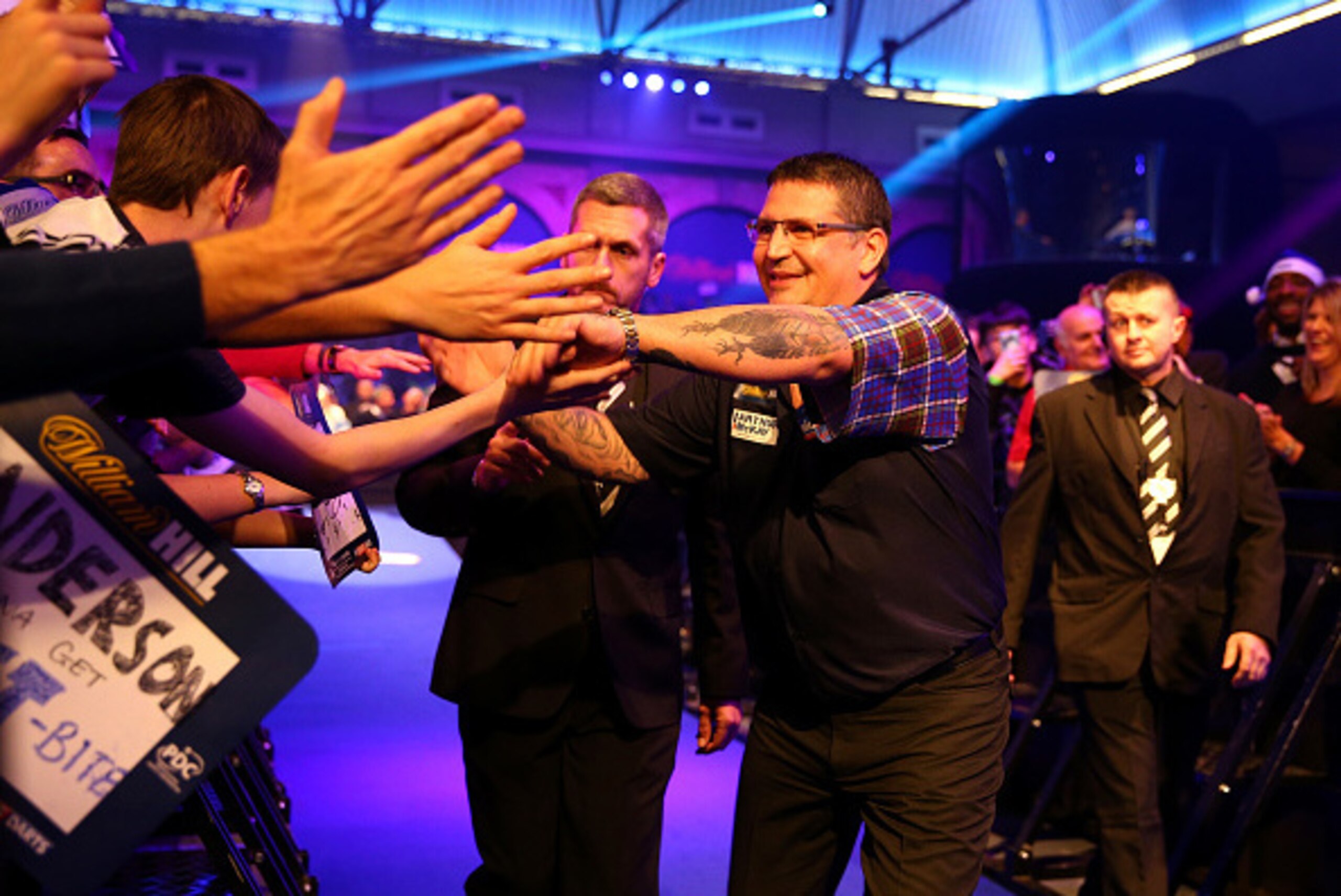 LONDON, ENGLAND - DECEMBER 15:  Gary Anderson of Scotland greats supporters during the walk on, prior to his first round match against Mark Frost of England during day one of the 2017 William Hill PDC World Darts Championships at Alexandra Palace on Decem