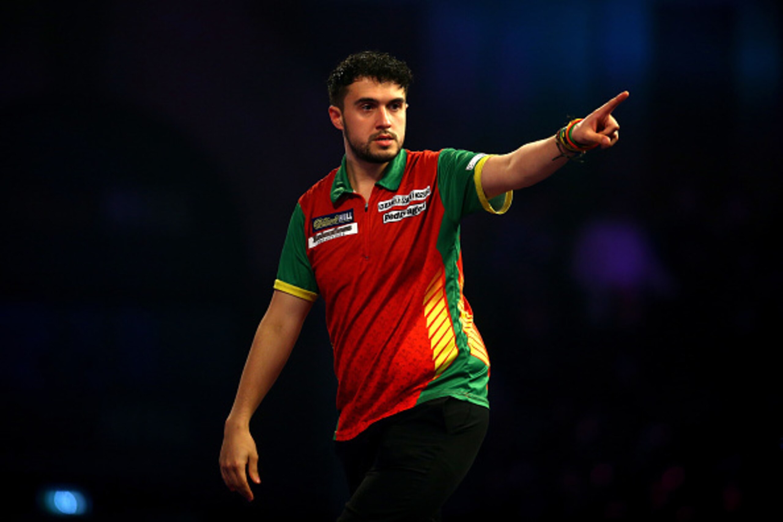 LONDON, ENGLAND - DECEMBER 15:  Jamie Lewis of Wales celebrates after a 180 during his first round match against Mick McGowan of Ireland during day one of the 2017 William Hill PDC World Darts Championships at Alexandra Palace on December 15, 2016 in Lond