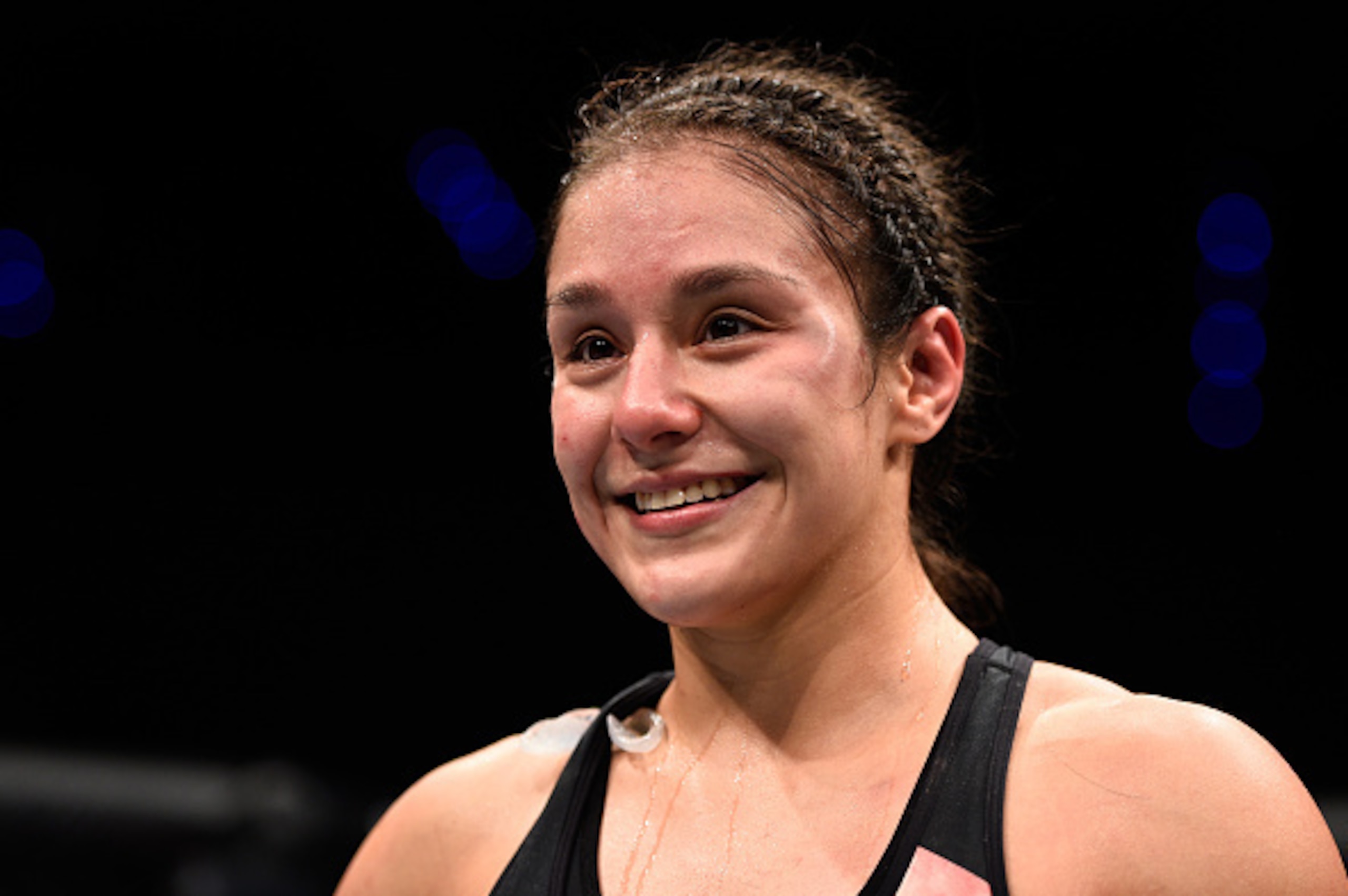 MEXICO CITY, MEXICO - NOVEMBER 05:  Alexa Grasso of Mexico celebrates her victory over Heather Jo Clark of the United States in their women's strawweight bout during the UFC Fight Night event at Arena Ciudad de Mexico on November 5, 2016 in Mexico City, M