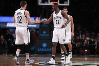 NEW YORK, NY - DECEMBER 14:  Caris LeVert #22 of the Brooklyn Nets celebrates with Joe Harris #12 against the Los Angeles Lakers in the first half at Barclays Center on December 14, 2016 in the Brooklyn borough of New York City. NOTE TO USER: User express