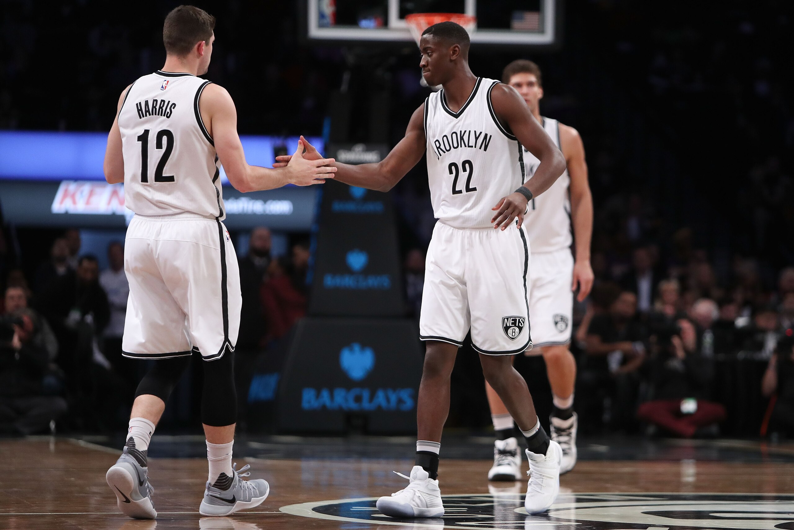 NEW YORK, NY - DECEMBER 14:  Caris LeVert #22 of the Brooklyn Nets celebrates with Joe Harris #12 against the Los Angeles Lakers in the first half at Barclays Center on December 14, 2016 in the Brooklyn borough of New York City. NOTE TO USER: User express