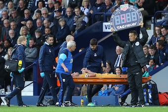 WEST BROMWICH, ENGLAND - OCTOBER 15: Mauricio Pochettino, Manager of Tottenham Hotspur pats Toby Alderweireld of Tottenham Hotspur on the chest after he is subbed off injured during the Premier League match between West Bromwich Albion and Tottenham Hotsp