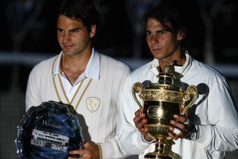 LONDON - JULY 06:  Rafael Nadal of Spain and Roger Federer of Switzerland pose for pictures with after Nadal won in five sets in the final on day thirteen of the Wimbledon Lawn Tennis Championships at the All England Lawn Tennis and Croquet Club on July 6
