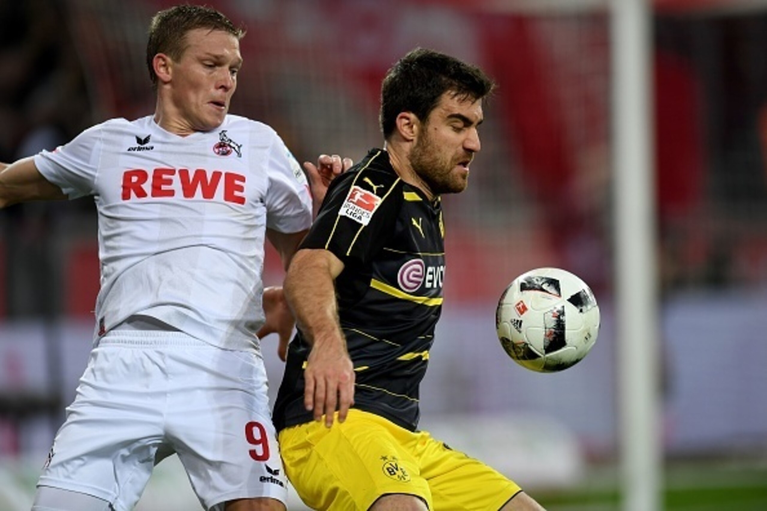 Cologne's Latvian striker Artjoms Rudnevs (L) and Dortmund's Greek defender Sokratis vie for the ball during the German first division Bundesliga football match of 1.FC Cologne vs Borussia Dortmund in Cologne, western Germany, on December 10, 2016. / AFP Cologne's Latvian striker Artjoms Rudnevs (L) and Dortmund's Greek defender Sokratis vie for the ball during the German first division Bundesliga football match of 1.FC Cologne vs Borussia Dortmund in Cologne, western Germany, on December 10, 2016. / AFP