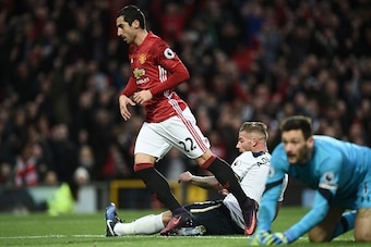 Manchester United's Armenian midfielder Henrikh Mkhitaryan (L) celebrates scoring the opening goal as Tottenham Hotspur's Belgian defender Toby Alderweireld (C) and Tottenham Hotspur's French goalkeeper Hugo Lloris react during the English Premier League 