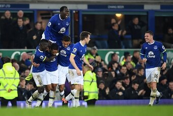 Everton's English-born Welsh defender Ashley Williams with Everton's Belgian striker Romelu Lukaku celebrates scoring his team's second goal during the English Premier League football match between Everton and Arsenal at Goodison Park in Liverpool, north 