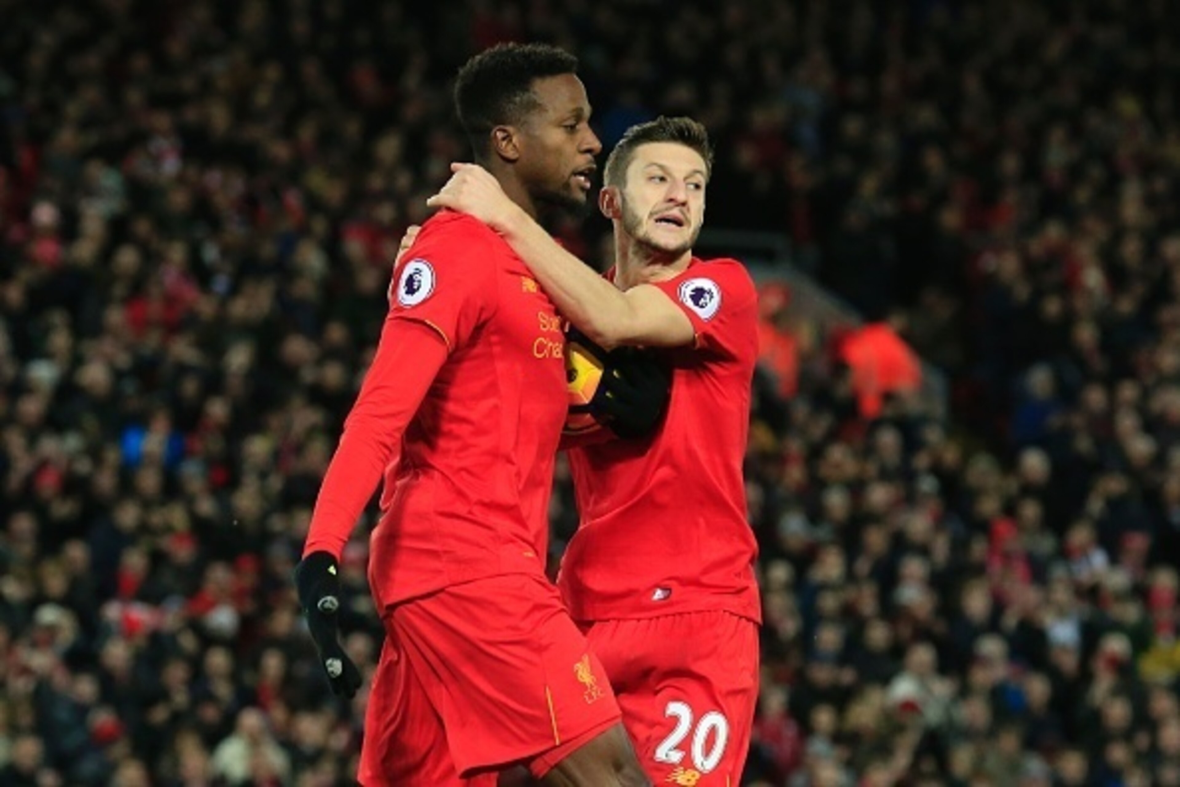Liverpool's Belgian striker Divock Origi (L) celebrates scoring their second goal to equalise with Liverpool's English midfielder Adam Lallana (R) during the English Premier League football match between Liverpool and West Ham United at Anfield in Liverpo Liverpool's Belgian striker Divock Origi (L) celebrates scoring their second goal to equalise with Liverpool's English midfielder Adam Lallana (R) during the English Premier League football match between Liverpool and West Ham United at Anfield in Liverpo