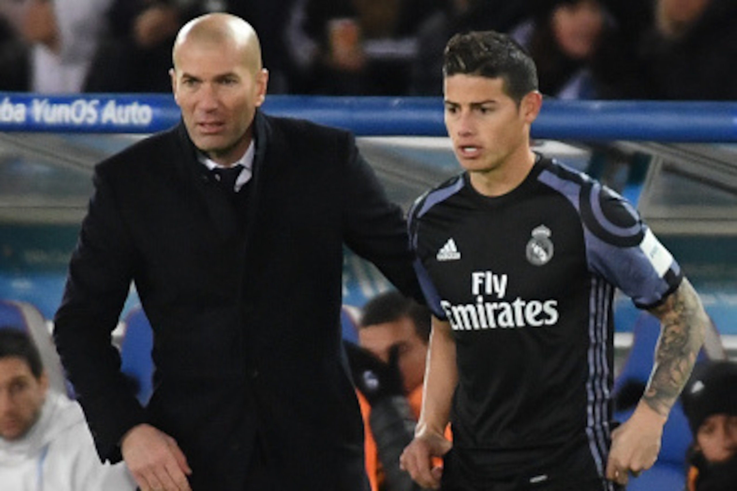 YOKOHAMA, JAPAN - DECEMBER 15:  Zinedine Zidane,coach (L) and James Rodriguez of Real Madrid look on during the FIFA Club World Cup Semi Final between Club America and Real Madrid at International Stadium Yokohama on December 15, 2016 in Yokohama, Japan. 