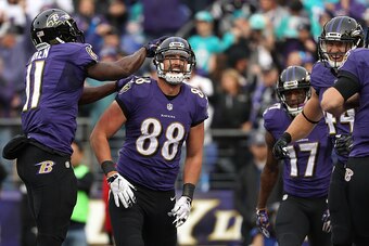 BALTIMORE, MD - DECEMBER 4: Tight end Dennis Pitta #88 of the Baltimore Ravens celebrates with teammate wide receiver Kamar Aiken #11 after scoring a second quarter touchdown against the Miami Dolphins at M&T Bank Stadium on December 4, 2016 in Baltimore,