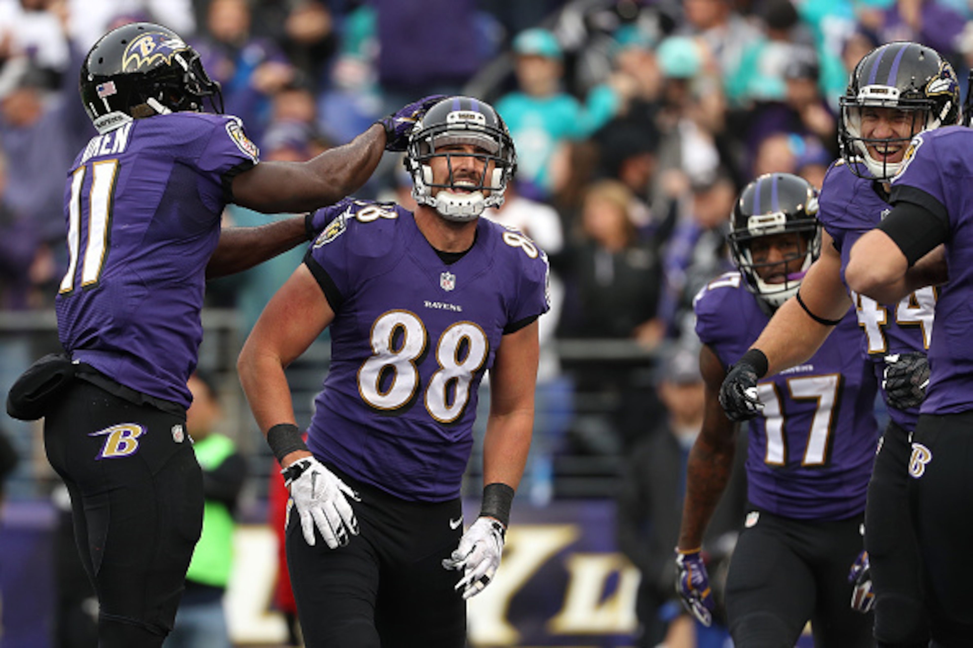 BALTIMORE, MD - DECEMBER 4: Tight end Dennis Pitta #88 of the Baltimore Ravens celebrates with teammate wide receiver Kamar Aiken #11 after scoring a second quarter touchdown against the Miami Dolphins at M&T Bank Stadium on December 4, 2016 in Baltimore,