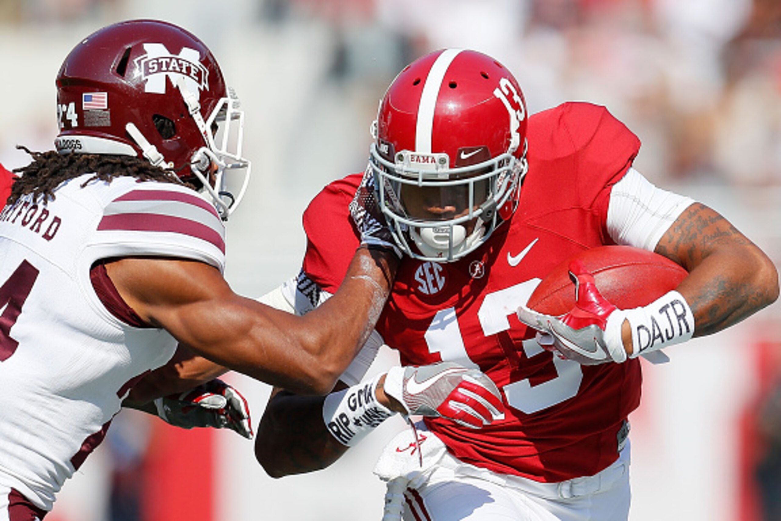 TUSCALOOSA, AL - NOVEMBER 12:  ArDarius Stewart #13 of the Alabama Crimson Tide attempts to break a tackle by Chris Rayford #24 of the Mississippi State Bulldogs at Bryant-Denny Stadium on November 12, 2016 in Tuscaloosa, Alabama.  (Photo by Kevin C. Cox/