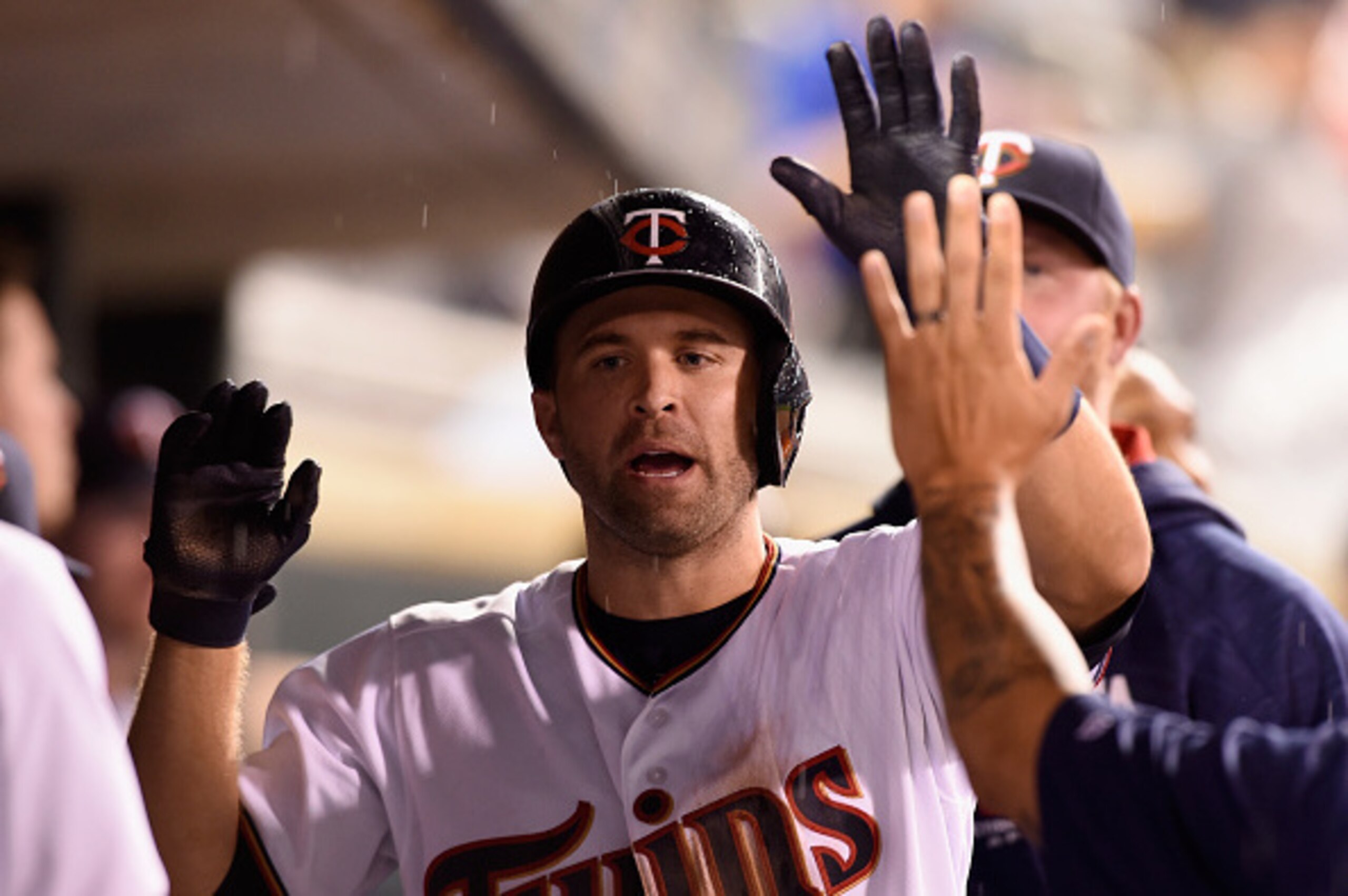 MINNEAPOLIS, MN - AUGUST 23: Brian Dozier #2 of the Minnesota Twins celebrates hitting a solo home run against the Detroit Tigers during the fifth inning of the game on August 23, 2016 at Target Field in Minneapolis, Minnesota. The Tigers defeated the Twi MINNEAPOLIS, MN - AUGUST 23: Brian Dozier #2 of the Minnesota Twins celebrates hitting a solo home run against the Detroit Tigers during the fifth inning of the game on August 23, 2016 at Target Field in Minneapolis, Minnesota. The Tigers defeated the Twi
