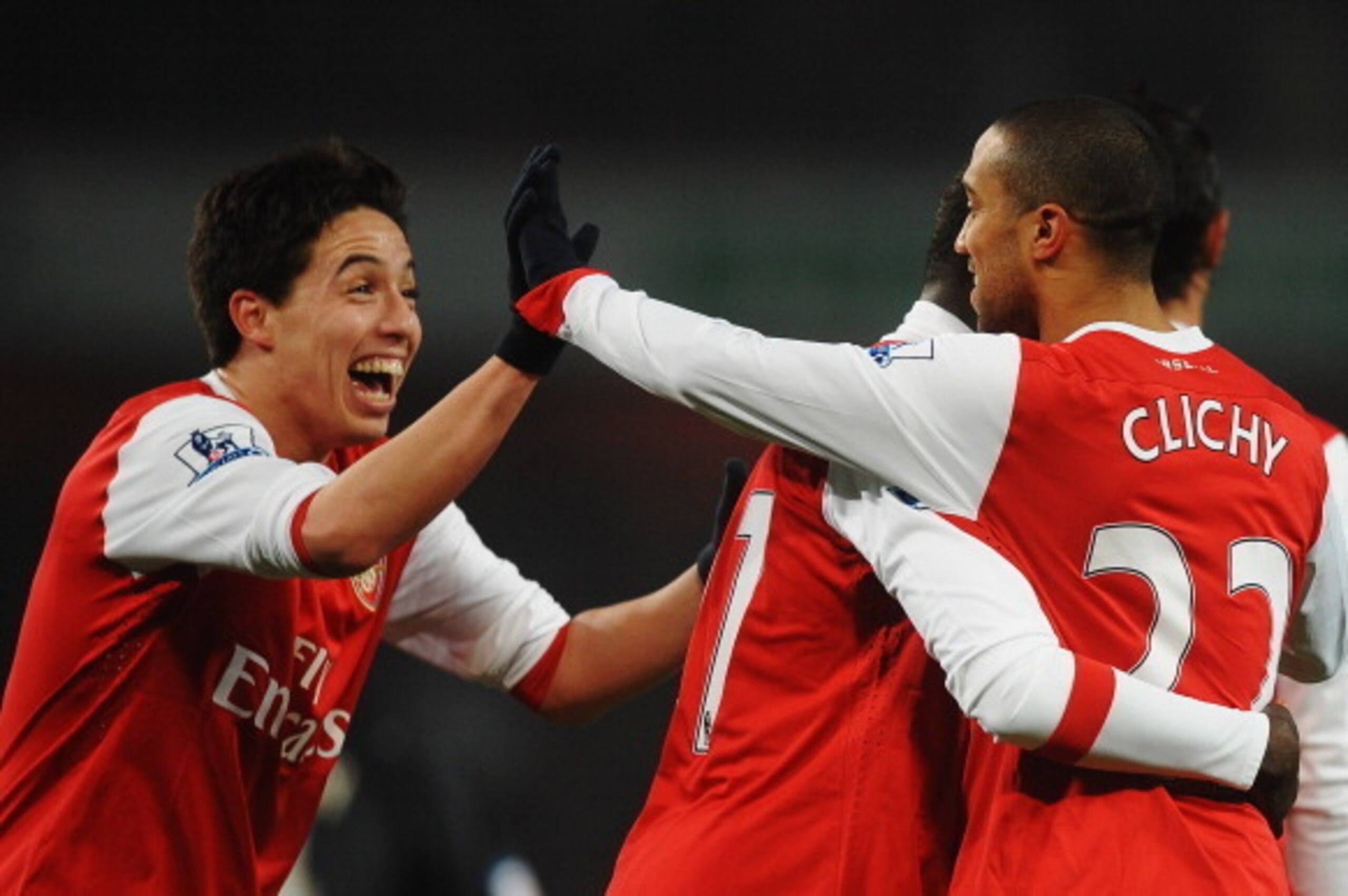 LONDON, UNITED KINGDOM - MARCH 02:  Gael Clichy (R) of Arsenal celebrates with team mate Samir Nasri (L) after scoring his sides fifth goal during the FA Cup sponsored by E.ON 5th Round Replay match between between Arsenal and Leyton Orient at the Emirate