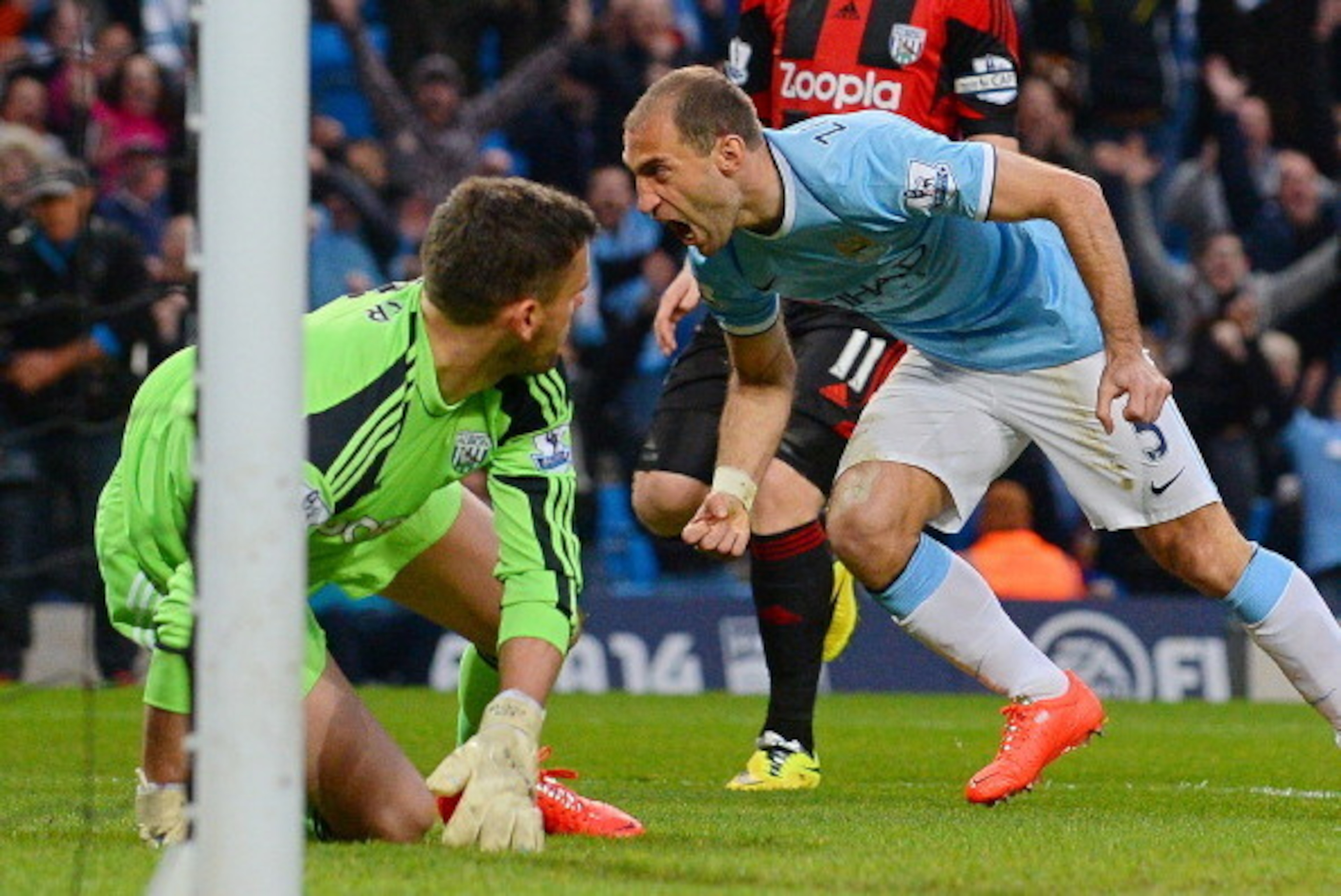 Manchester City's Argentinian defender Pablo Zabaleta (R) celebrates after scoring his team's opening goal during the English Premier League football match between Manchester City and West Bromwich Albion at the Etihad Stadium in Manchester on April 21, 2 Manchester City's Argentinian defender Pablo Zabaleta (R) celebrates after scoring his team's opening goal during the English Premier League football match between Manchester City and West Bromwich Albion at the Etihad Stadium in Manchester on April 21, 2