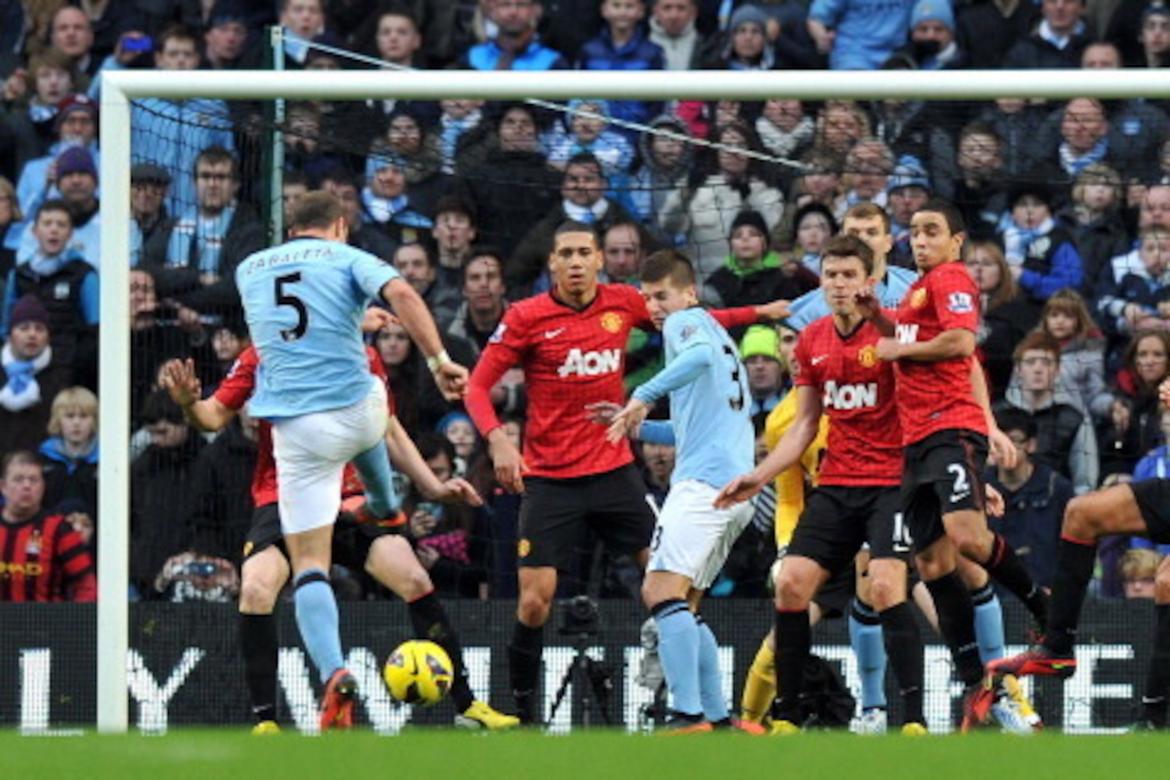 Manchester City's Argentian defender Pablo Zabaleta (L) scores the equalising goal during the English Premier League football match between Manchester City and Manchester United at The Etihad Stadium in Manchester, north-west England, on December 9, 2012. Manchester City's Argentian defender Pablo Zabaleta (L) scores the equalising goal during the English Premier League football match between Manchester City and Manchester United at The Etihad Stadium in Manchester, north-west England, on December 9, 2012.