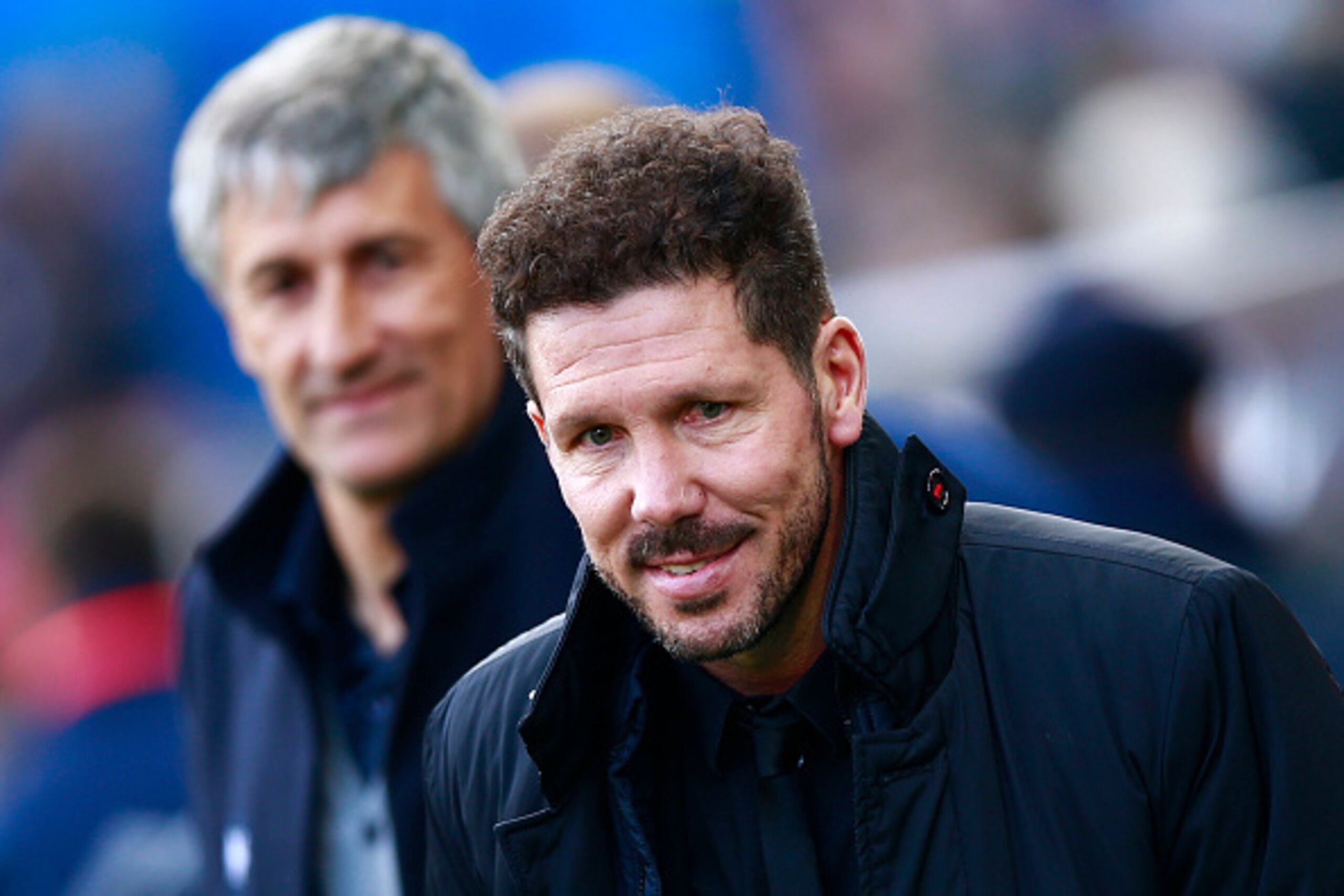 MADRID, SPAIN - DECEMBER 17: Coach Diego Pablo Simeone (R) of Atletico de Madrid walks to the bench after having clashed hands with coach Quique Setien (L) of UD Las Palmasduring the La Liga match between Club Atletico de Madrid and UD Las Palmas at Vicen