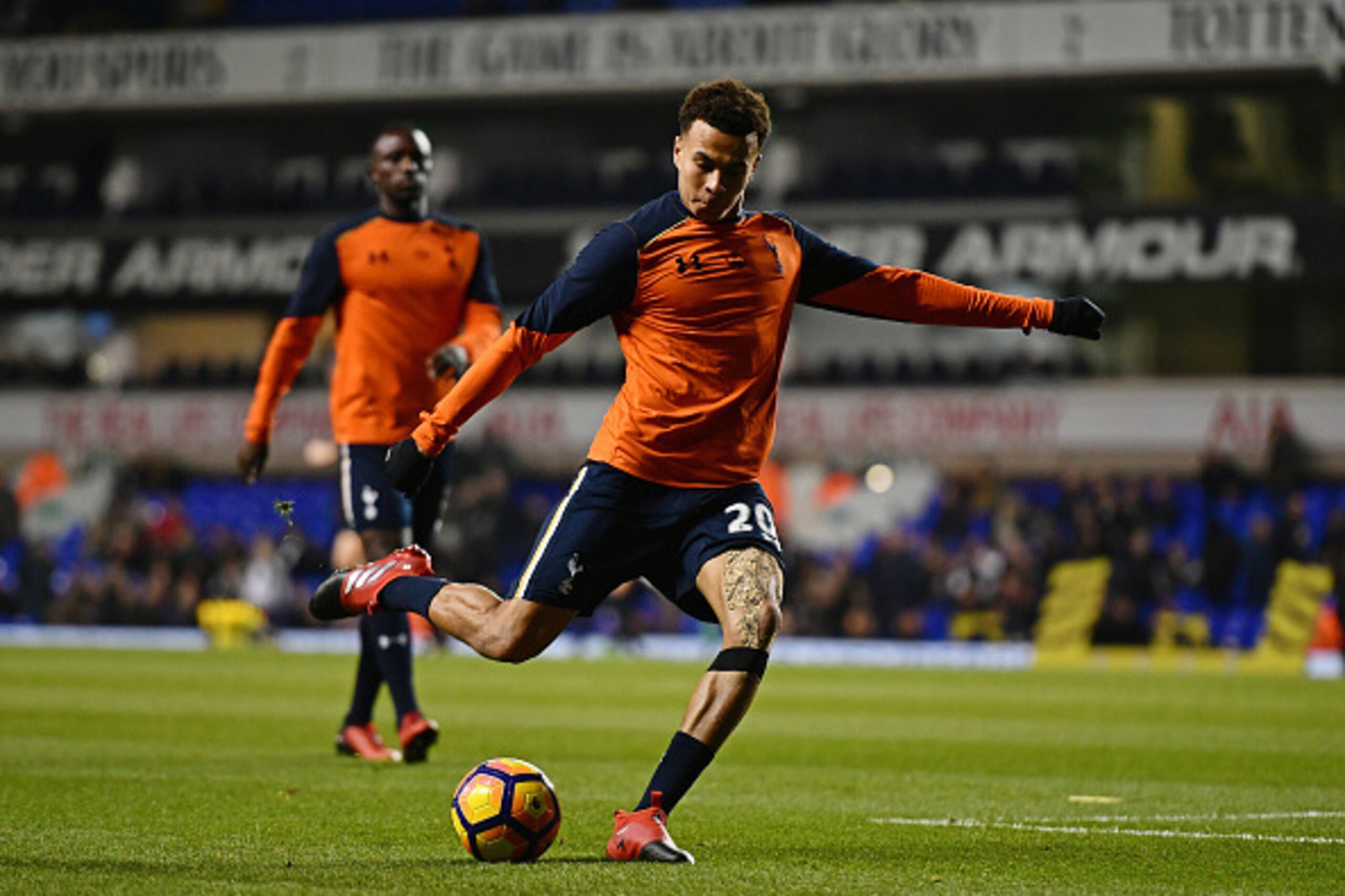 LONDON, ENGLAND - DECEMBER 14: Dele Alli of Tottenham Hotspur shoots during the warm up prior to kick off during the Premier League match between Tottenham Hotspur and Hull City at White Hart Lane on December 14, 2016 in London, England.  (Photo by Dan Mu