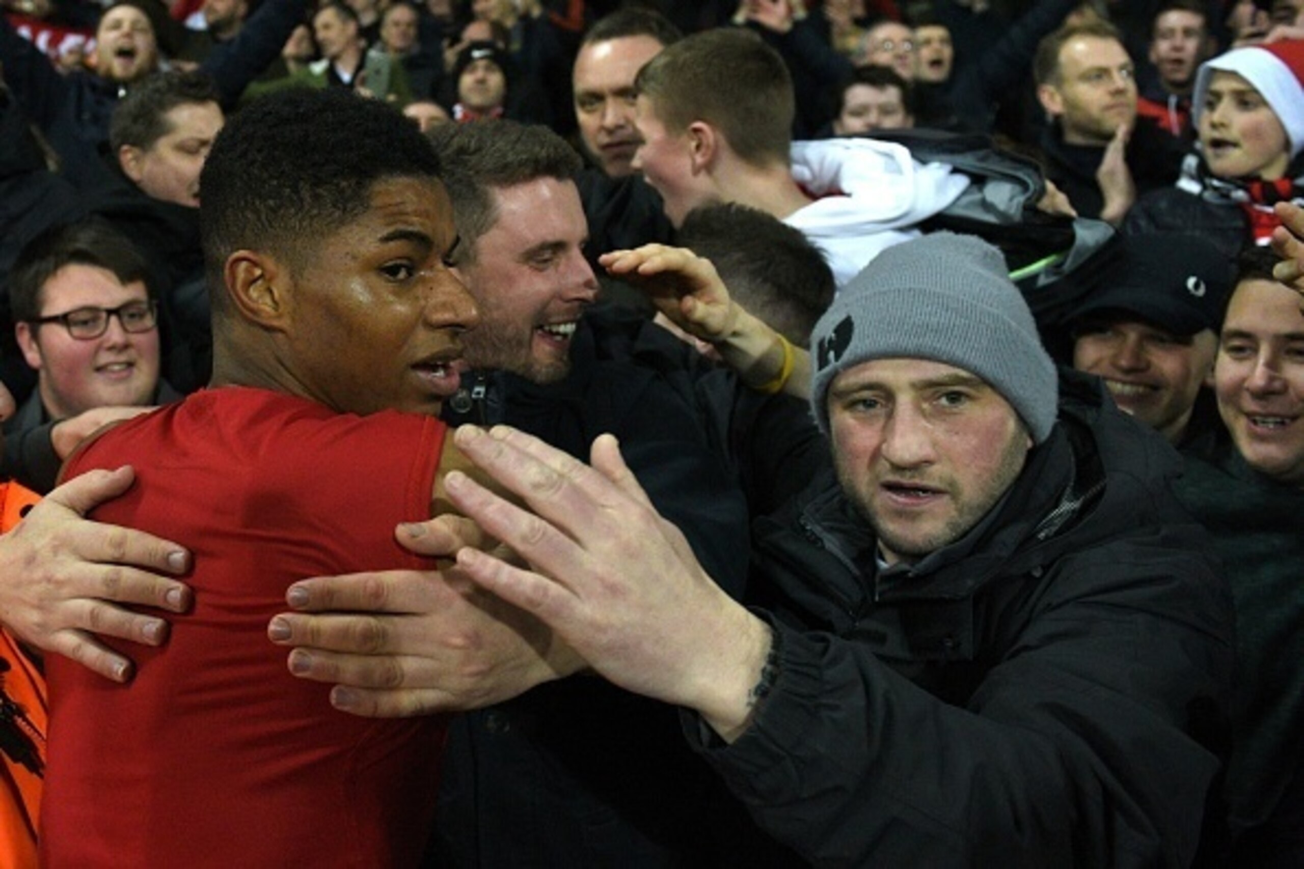 Manchester United's English striker Marcus Rashford (L) goes into the crowd as United players give away their shirts after the English Premier League football match between West Bromwich Albion and Manchester United at The Hawthorns stadium in West Bromwi Manchester United's English striker Marcus Rashford (L) goes into the crowd as United players give away their shirts after the English Premier League football match between West Bromwich Albion and Manchester United at The Hawthorns stadium in West Bromwi