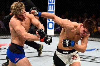 SACRAMENTO, CA - DECEMBER 17:  (R-L) Mickey Gall punches Sage Northcutt in their welterweight bout during the UFC Fight Night event inside the Golden 1 Center Arena on December 17, 2016 in Sacramento, California. (Photo by Jeff Bottari/Zuffa LLC/Zuffa LLC