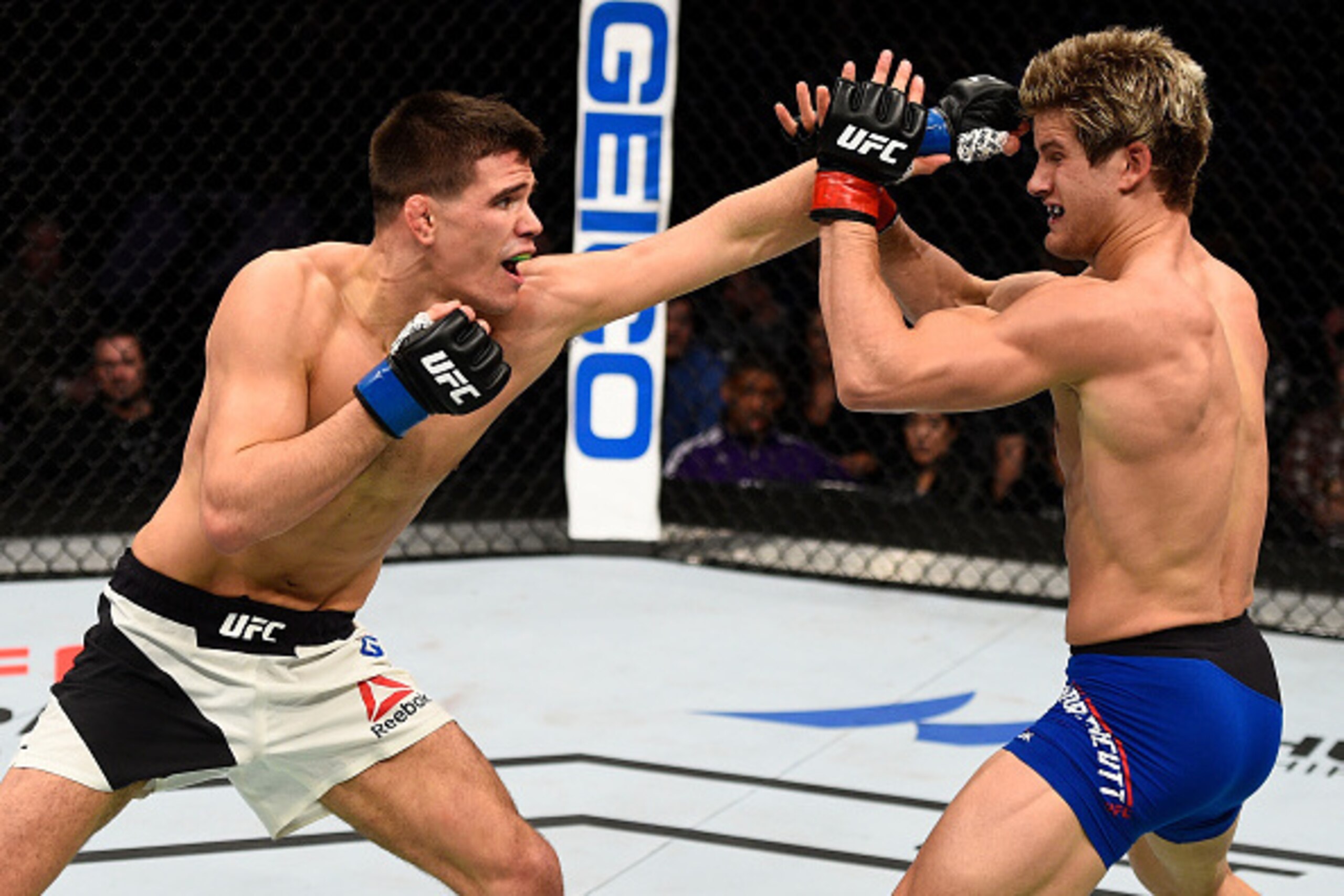 SACRAMENTO, CA - DECEMBER 17:  (L-R) Mickey Gall punches Sage Northcutt in their welterweight bout during the UFC Fight Night event inside the Golden 1 Center Arena on December 17, 2016 in Sacramento, California. (Photo by Jeff Bottari/Zuffa LLC/Zuffa LLC