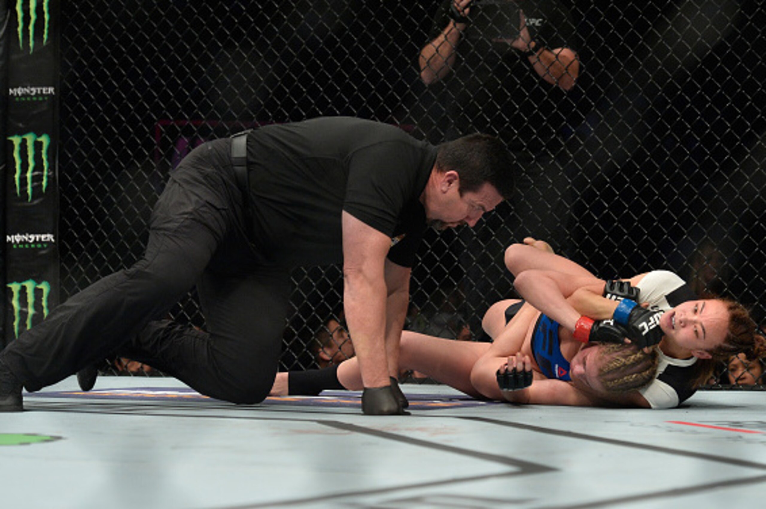 SACRAMENTO, CA - DECEMBER 17:  (R-L) Michelle Waterson attempts to submit Paige VanZant in their women's strawweight bout during the UFC Fight Night event inside the Golden 1 Center Arena on December 17, 2016 in Sacramento, California. (Photo by Brandon M