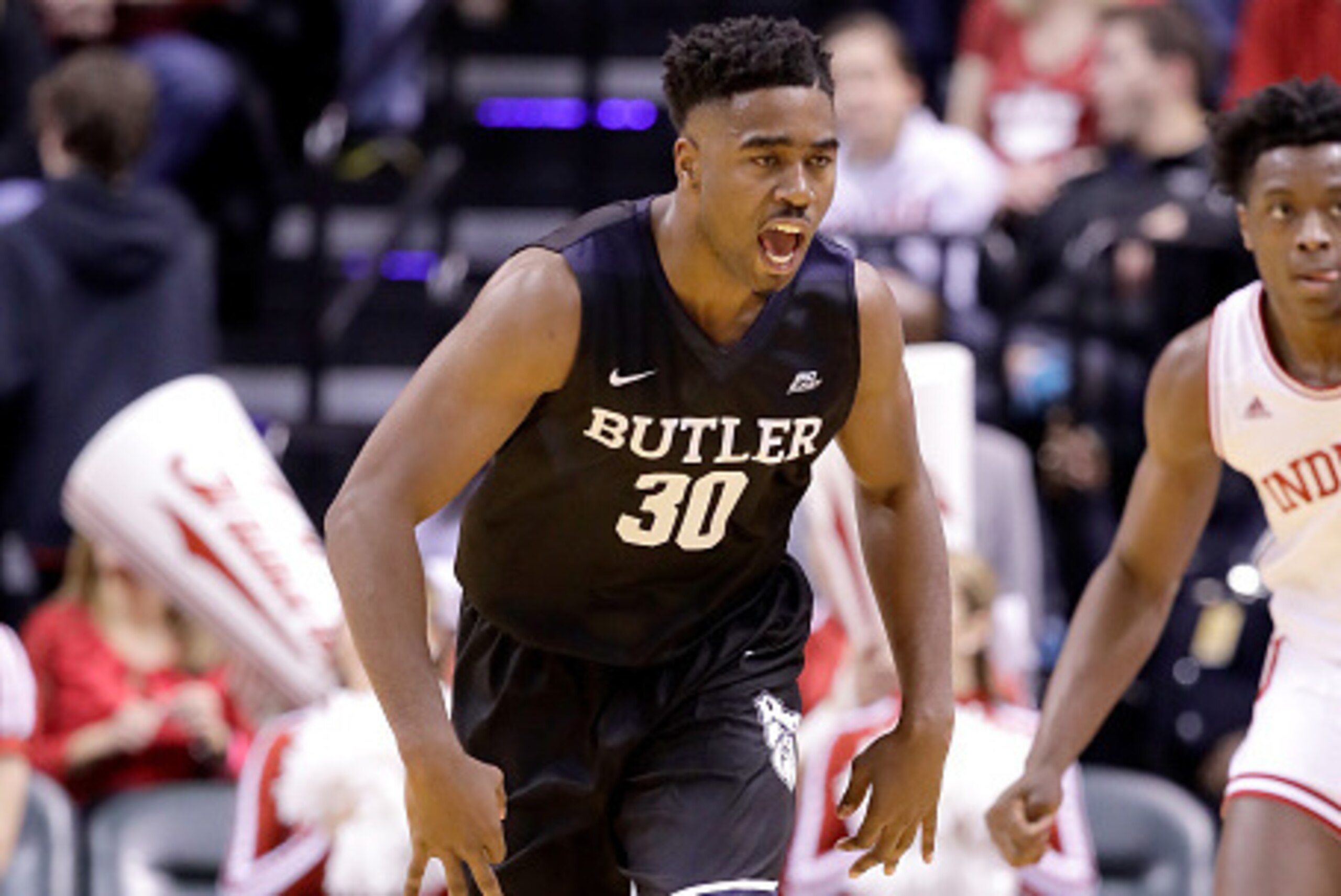 INDIANAPOLIS, IN - DECEMBER 17:   Kelan Martin #30 of the Butler Bulldogs celebrates during the 83-78 win over the Indiana Hoosiers during the Crossroads Classic at Bankers Life Fieldhouse on December 17, 2016 in Indianapolis, Indiana.  (Photo by Andy Lyo