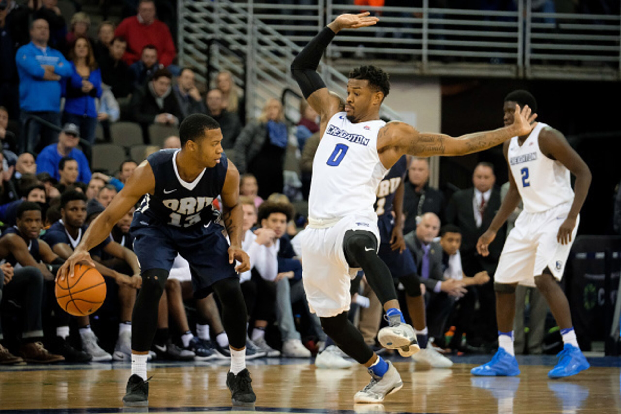 OMAHA, NEBRASKA-DECEMBER 17: Marcus Foster #0 of the Creighton Bluejays guards Aaron Anderson #13 of the Oral Roberts Golden Eagles during their game  at the CenturyLink Center on December 17, 2016 in Omaha, Nebraska. (Photo by Eric Francis/Getty Images)