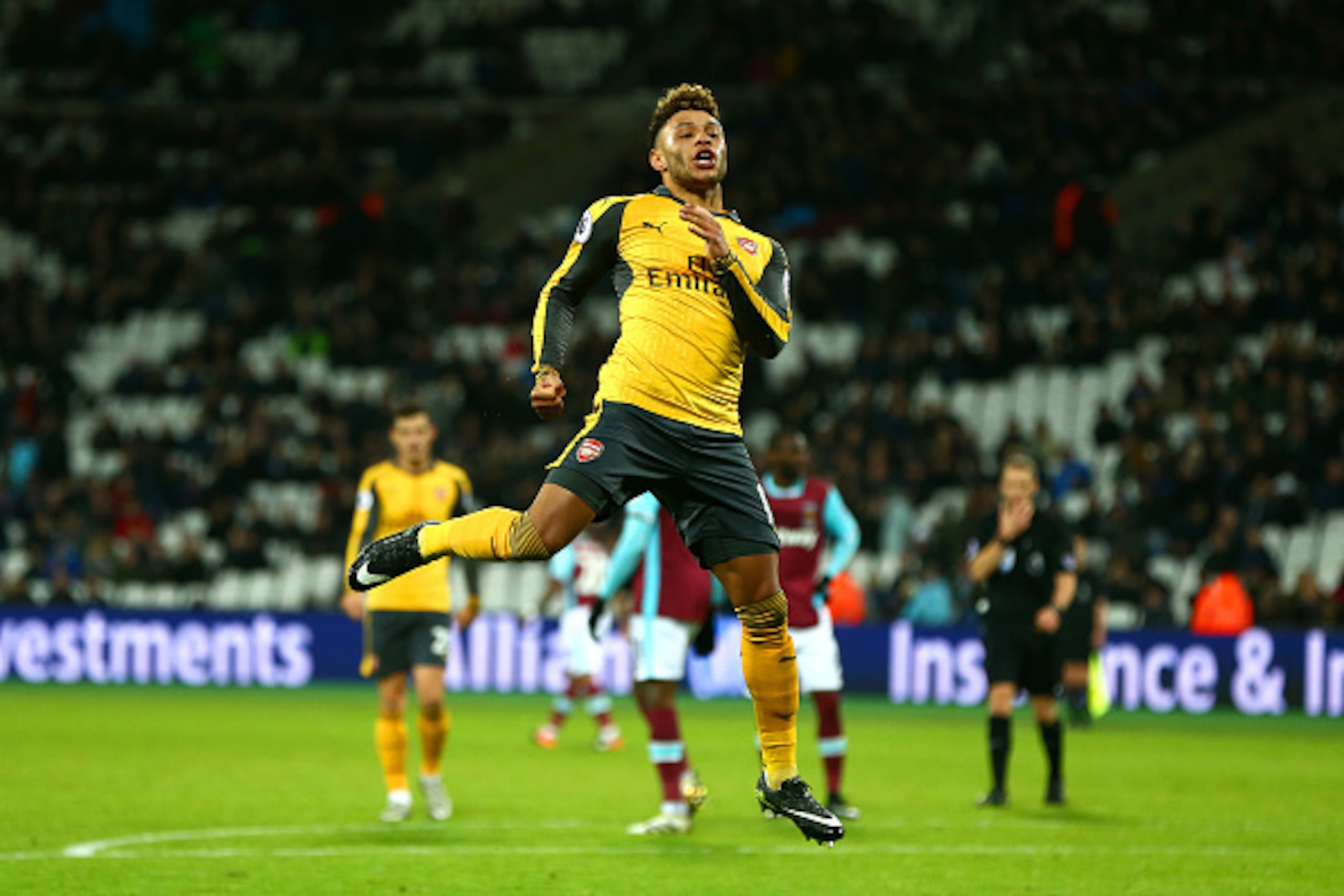 LONDON, ENGLAND - DECEMBER 03:  Alex Oxlade-Chamberlain of Arsenal celebrates after scoring his team's fourth goal during the Premier League match between West Ham United and Arsenal at London Stadium on December 3, 2016 in London, England.  (Photo by Jor