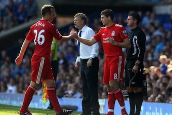 LIVERPOOL, ENGLAND - OCTOBER 01:  Steven Gerrard of Liverpool comes on as a substitute for team mate Charlie Adam during the Barclays Premier League match between Everton and Liverpool at Goodison Park on October 1, 2011 in Liverpool, England. (Photo by C