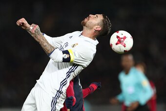 Real Madrid defender Sergio Ramos fights for the ball during the Club World Cup football final match between Kashima Antlers of Japan and Real Madrid of Spain at Yokohama International stadium in Yokohama on December 18, 2016. / AFP / Behrouz MEHRI       