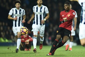 Manchester United's French midfielder Paul Pogba has an unsuccessful shot during the English Premier League football match between West Bromwich Albion and Manchester United at The Hawthorns stadium in West Bromwich, central England, on December 17, 2016.