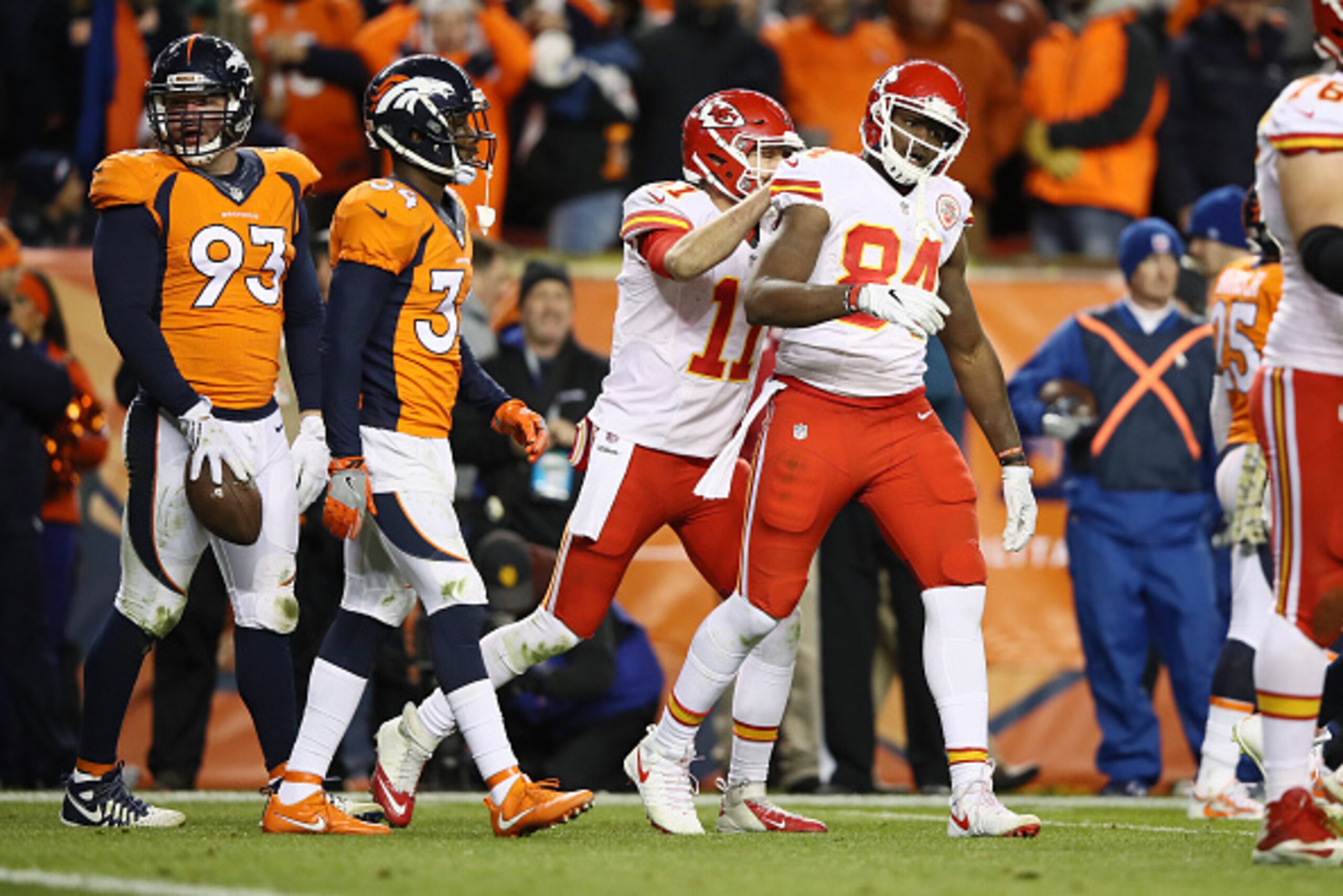DENVER, CO - NOVEMBER 28:  Quarterback Alex Smith #11 of the Kansas City Chiefs celebrates with tight end Demetrius Harris #84 after Harris caught a pass on a two-point conversion to tie the game in the fourth quarter against the Denver Broncos at Sports 