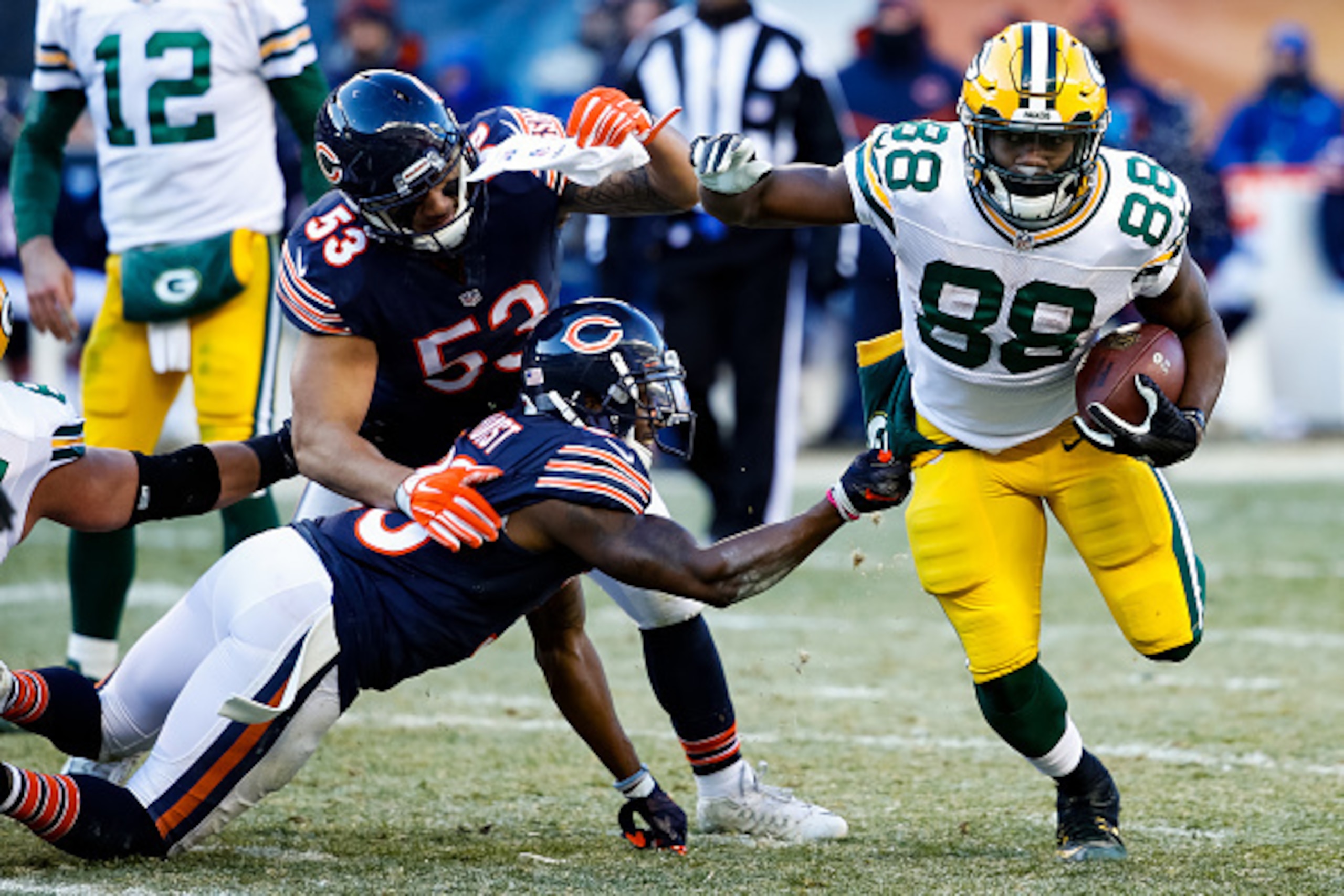 CHICAGO, IL - DECEMBER 18:   Demontre Hurst #30 of the Chicago Bears grabs onto  Ty Montgomery #88 of the Green Bay Packers in the third quarter at Soldier Field on December 18, 2016 in Chicago, Illinois.  (Photo by Joe Robbins/Getty Images)